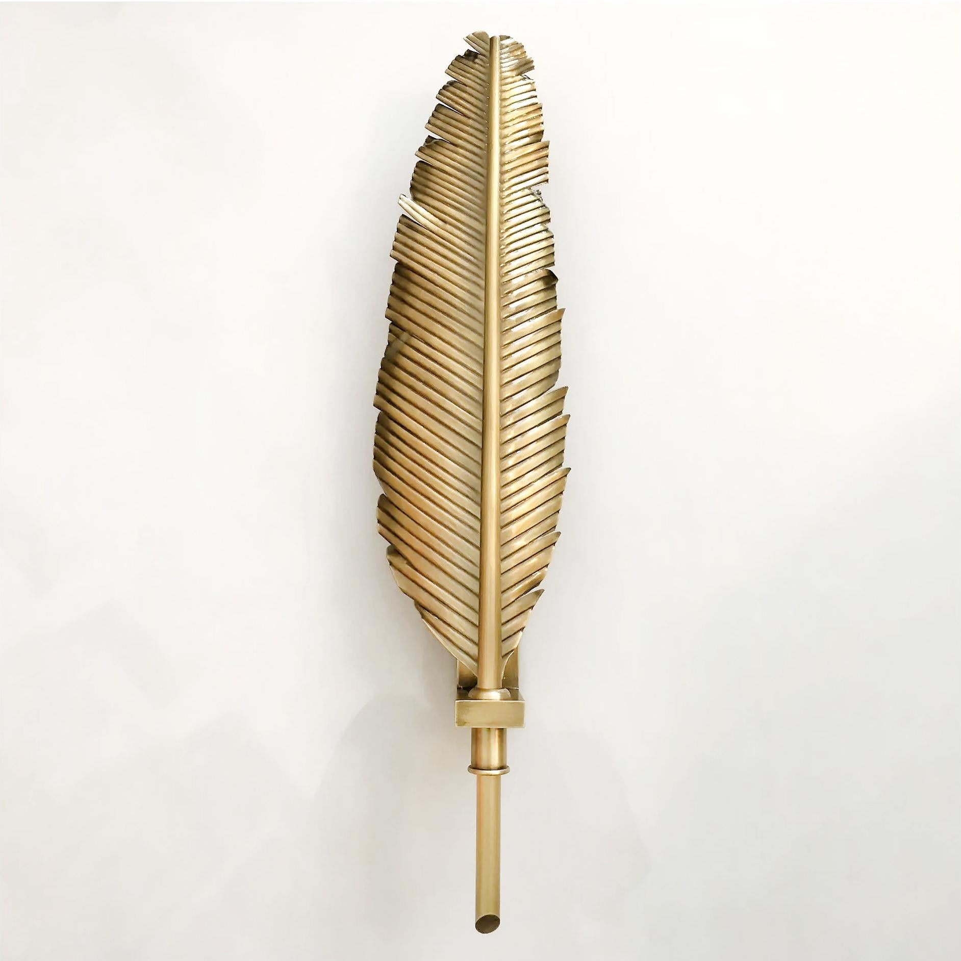 Pair of wall lights shaped as feathers. Wall-mounted, with indirect light, made of brass.
Measure: Height circa 60 cm [23 in.].
These lights are entirely hand-made and they are available in different finishes (see the color table).
Standard