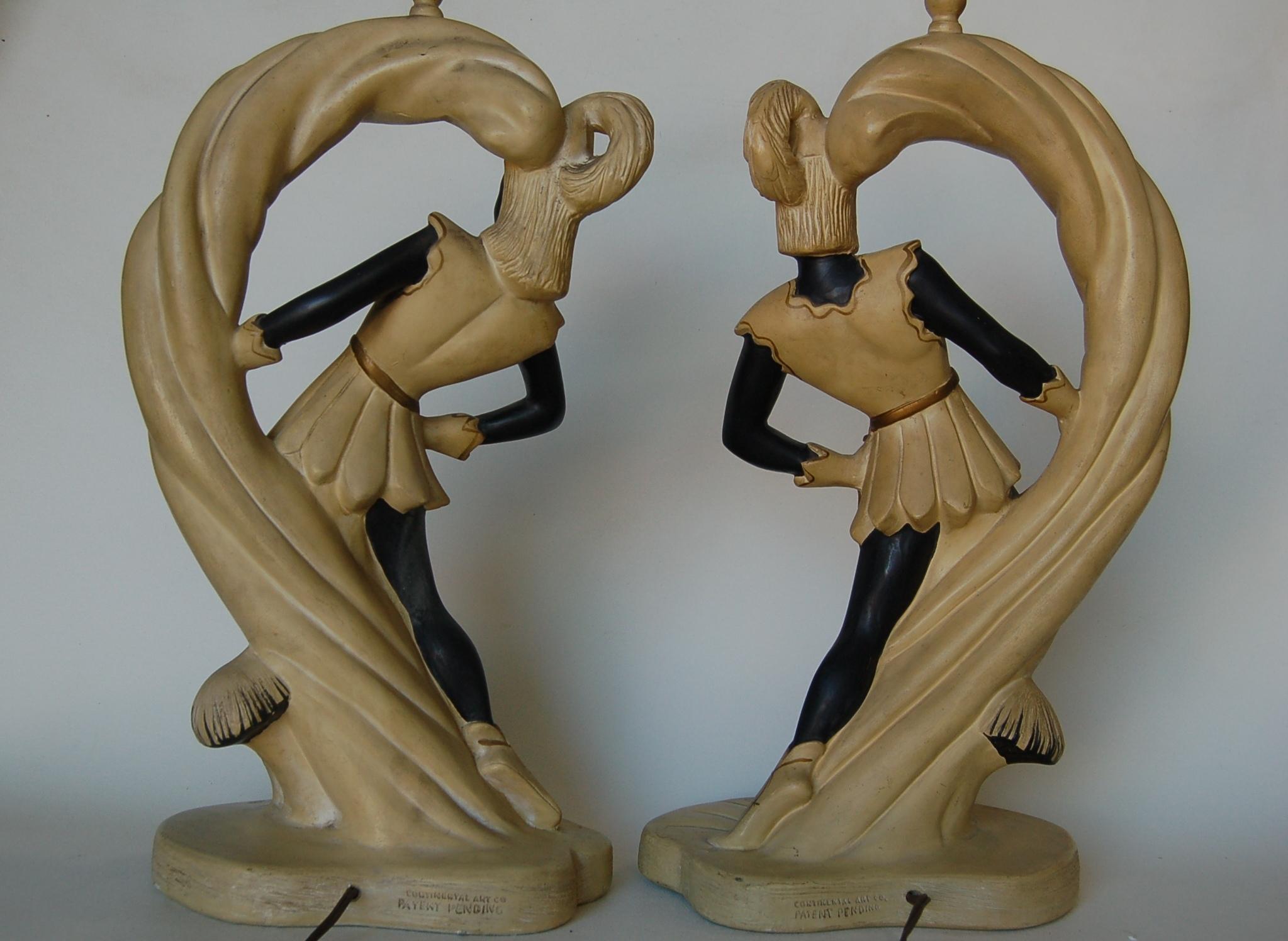 Pair of midcentury Saxon crusader Robin Hood wood nymph themed chalkware figural table lamps. Made by Continental Art Company. 

Measures 10