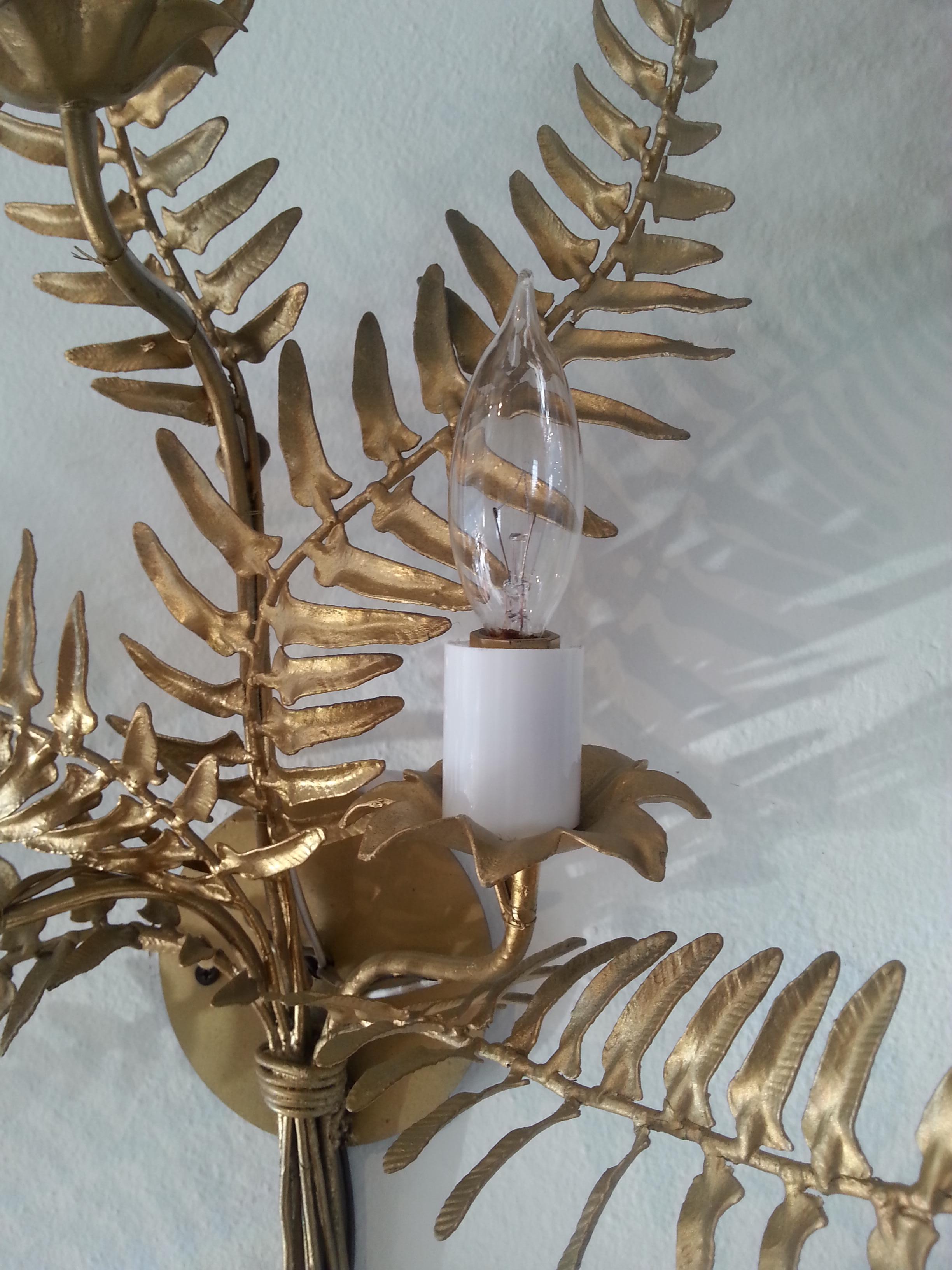 This stylish and chic pair of wall scones with their gold finished fern fronds will make a definite statement. Each sconces varies in height and width for a more naturalistic look.

Note: Dimensions of one sconce is 27