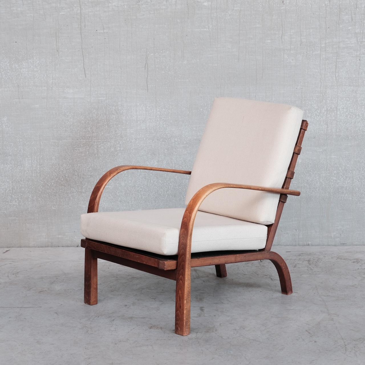 A pair of mid-century armchairs by Ernst Heilmann-Sevaldsen for Fritz Hansen. 

FH-7 Model. 

Denmark, c1930s. 

A rare model with a timeless pairing of wood, leather and upholstery raised over kicked out curvy back legs. 

Beech frame,