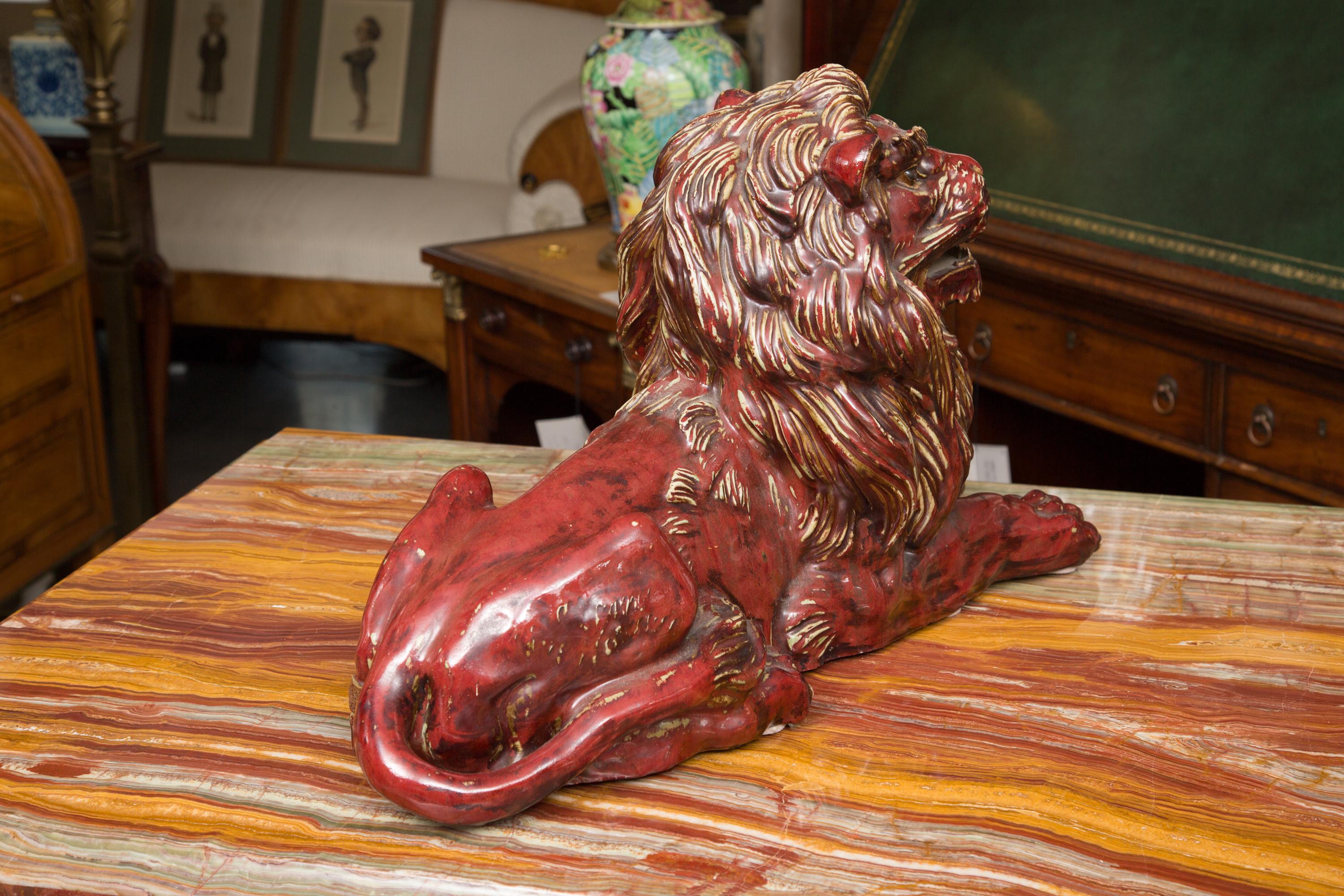 Fired Pair of Fiance Glazed Recumbent Lions