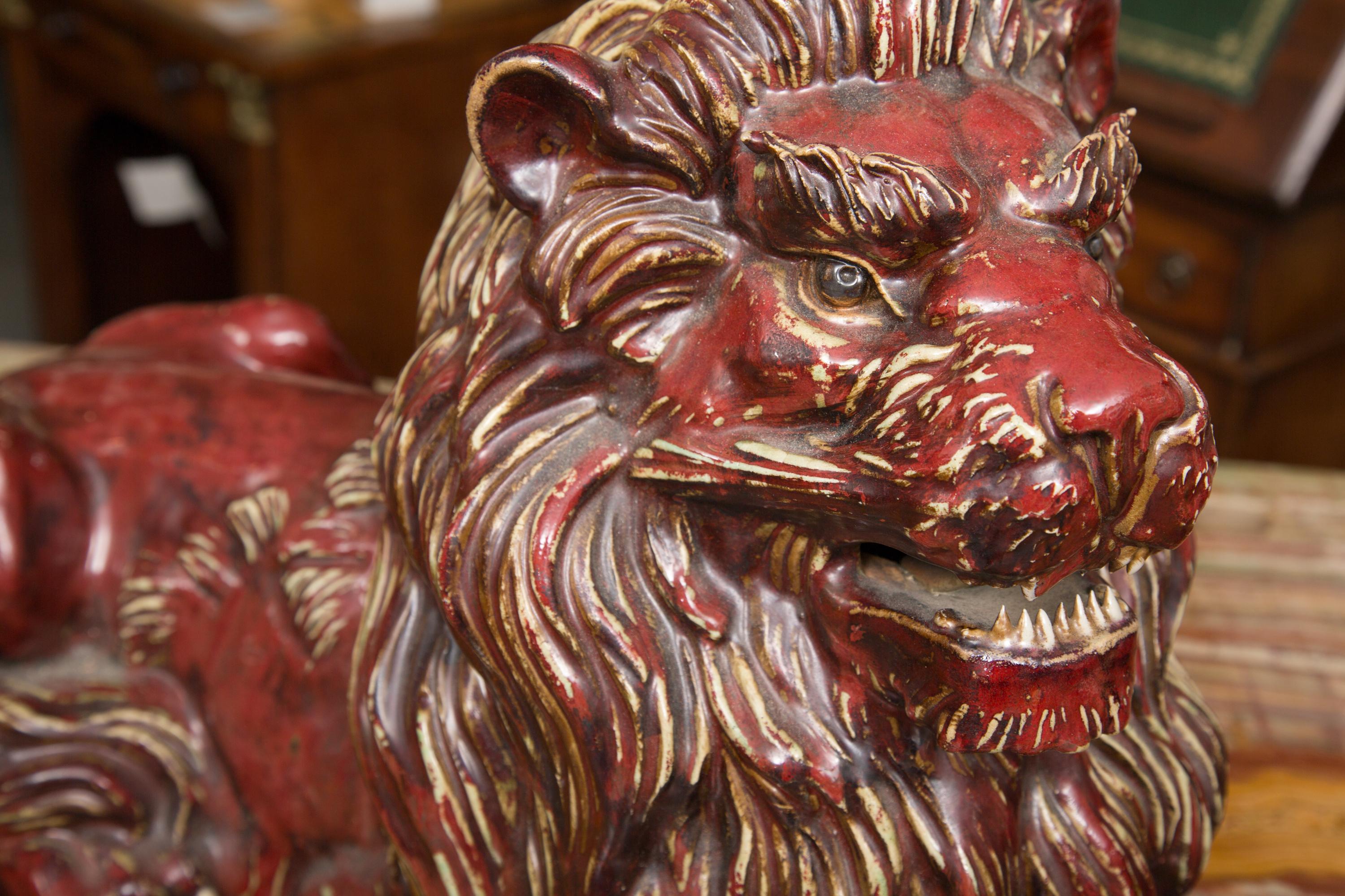 Pair of Fiance Glazed Recumbent Lions In Good Condition In WEST PALM BEACH, FL