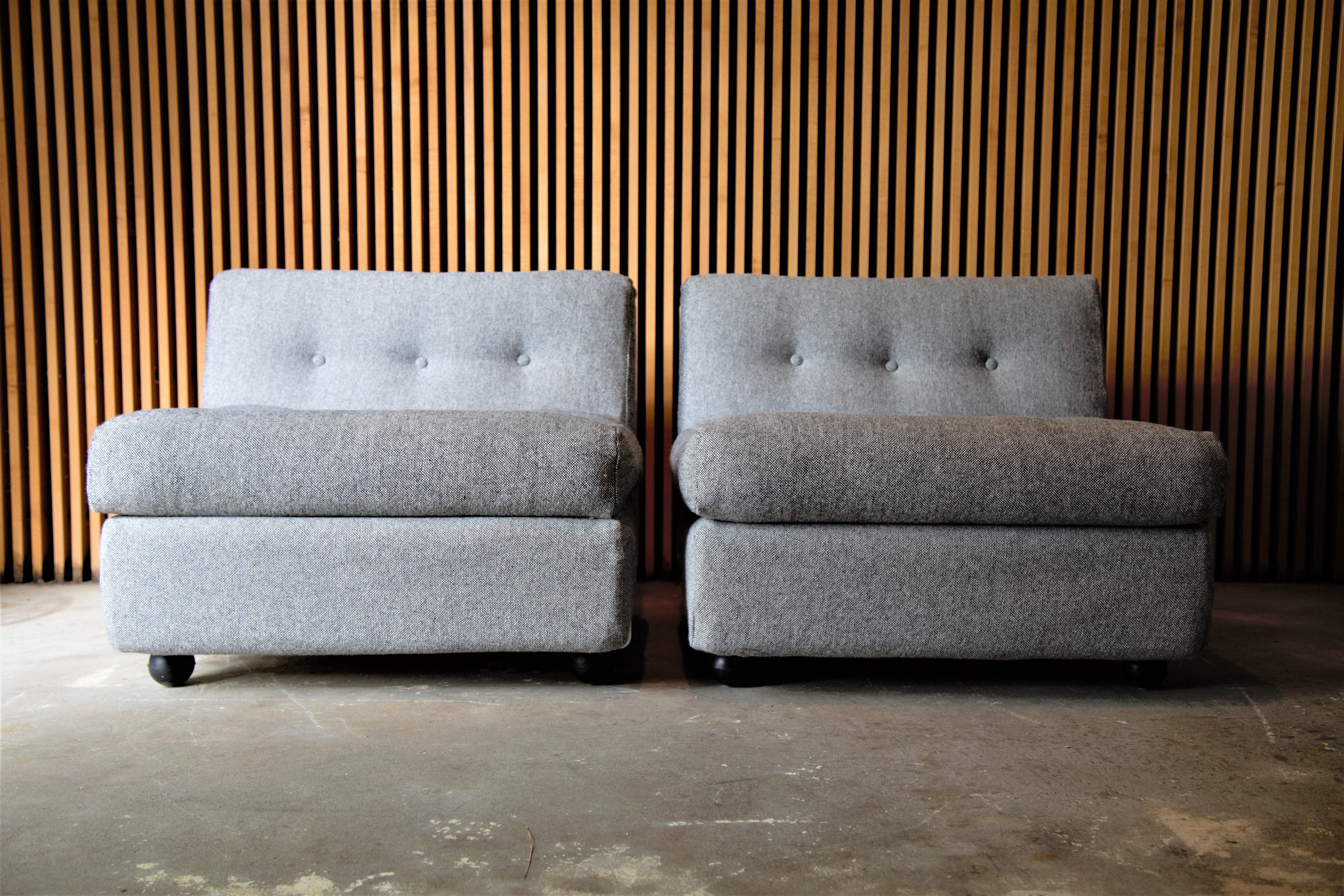 A pair of fiberglass Amanta chairs designed by Mario Bellini for B&B Italia. New maharam hallingdal wool fabric. These examples imported from Italy. 

Condition:
Light wear and abrasion to the white fiberglass shells, overall show very well.