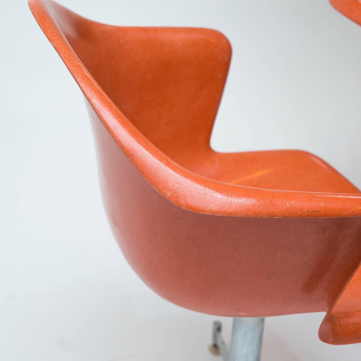 Made by the Douglass Furniture Company of El Segundo, California, these 1960s era chairs look pretty good for their age. Molded fiberglass season brushed aluminum swivel bases.