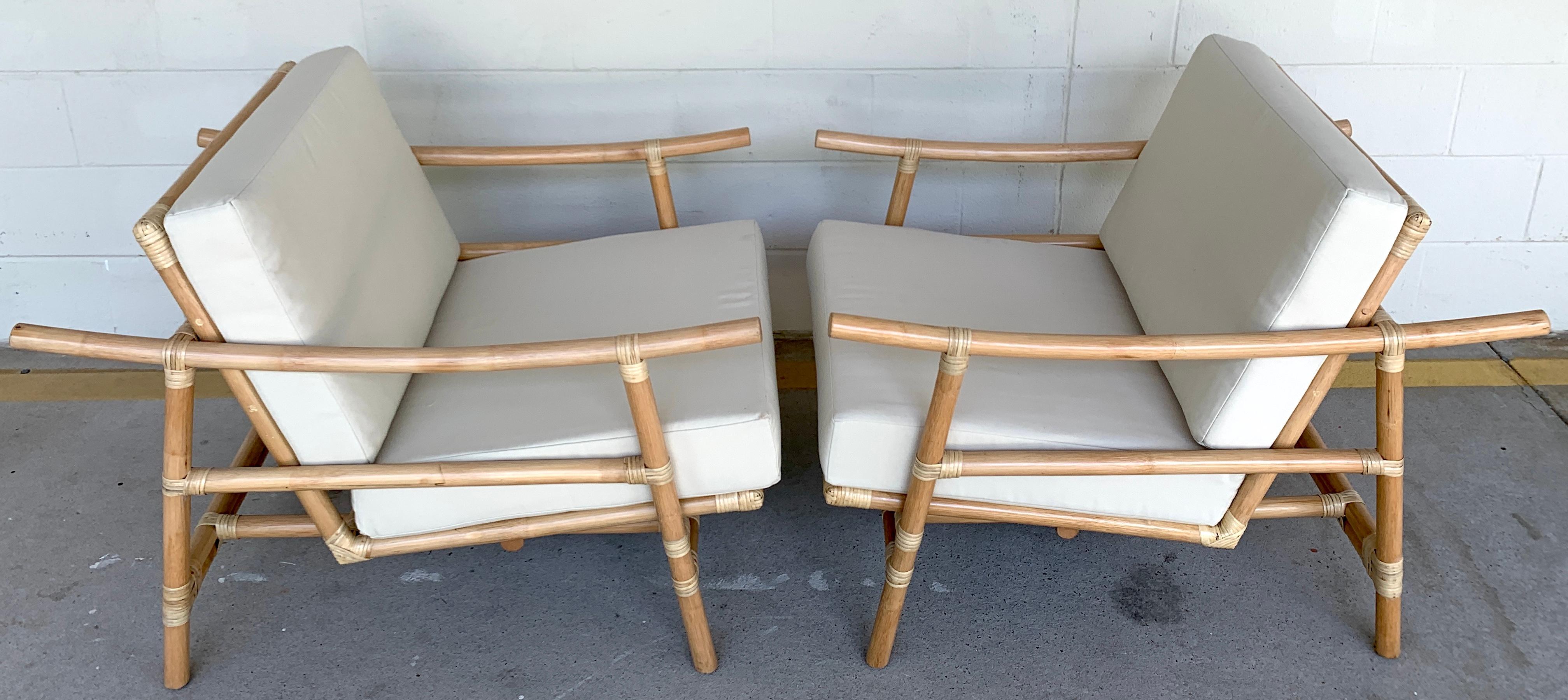 Pair of Ficks Reed natural rattan lounge club chairs by John Wisner, Restored,
Each one with beautiful natural finish, sturdy chairs. Complete with muslin template cushions. The cushions are recent and useable, ready for COM.
Measures: arm height