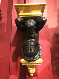 Pair of Figural Brackets Featuring Atlas