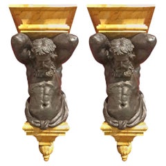 Pair of Figural Brackets Featuring Atlas