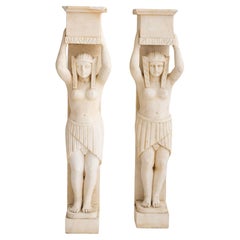 Pair of Figural Egyptian Style Marble Fireplace Surrounds