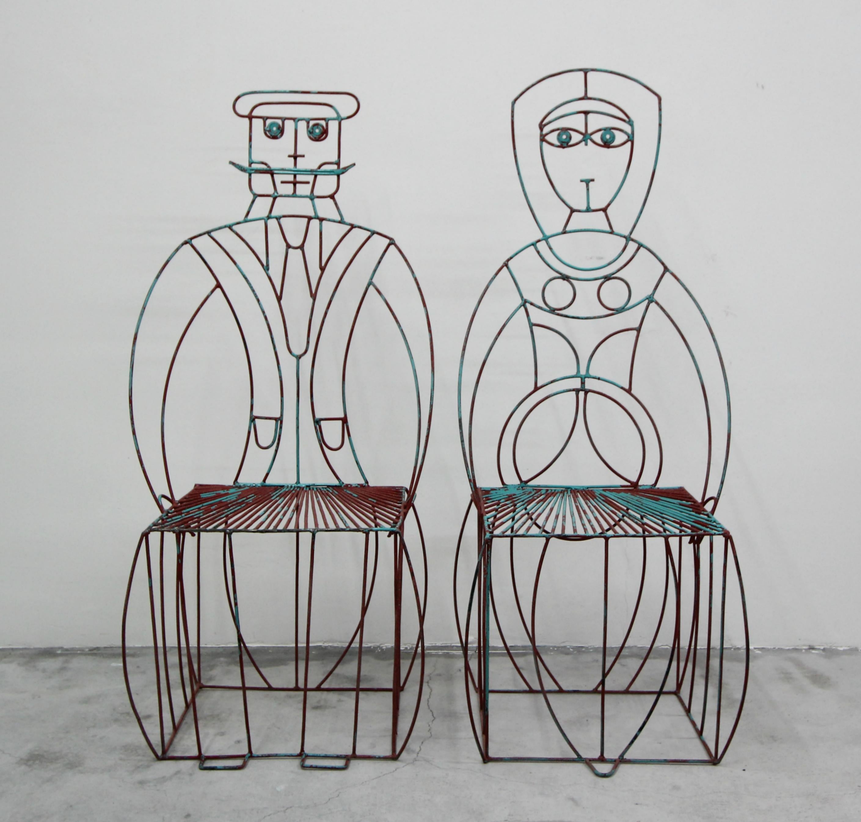 A pair of classic, figural his and hers wire chairs by John Risley. I love the concept of functional art and these whimsical chairs are no exception.

The chairs have been painted a couple times over the years and that paint is chipping off