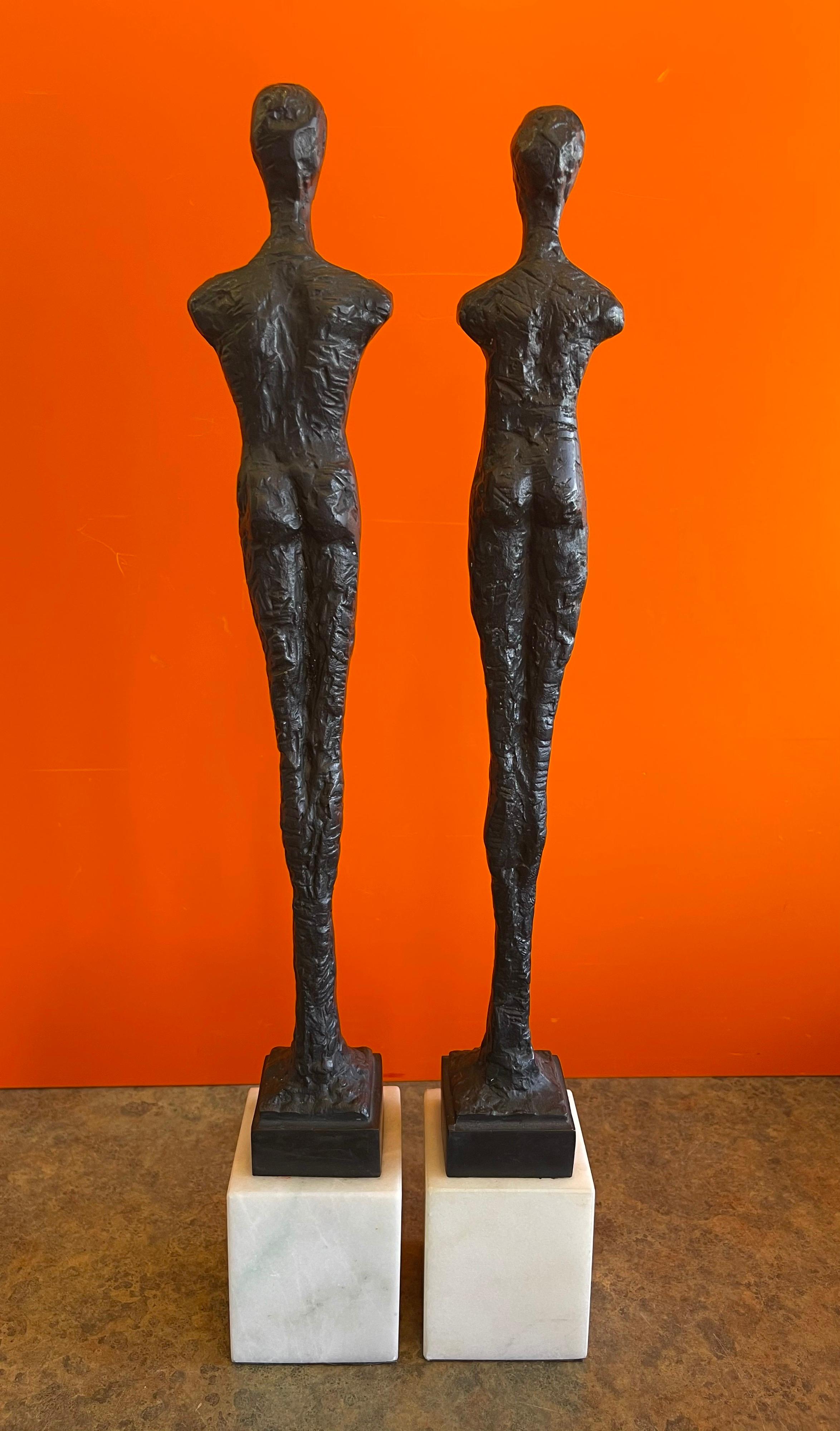 American Pair of Figurative Bronze Man & Woman Sculptures in the Style of Giacometti