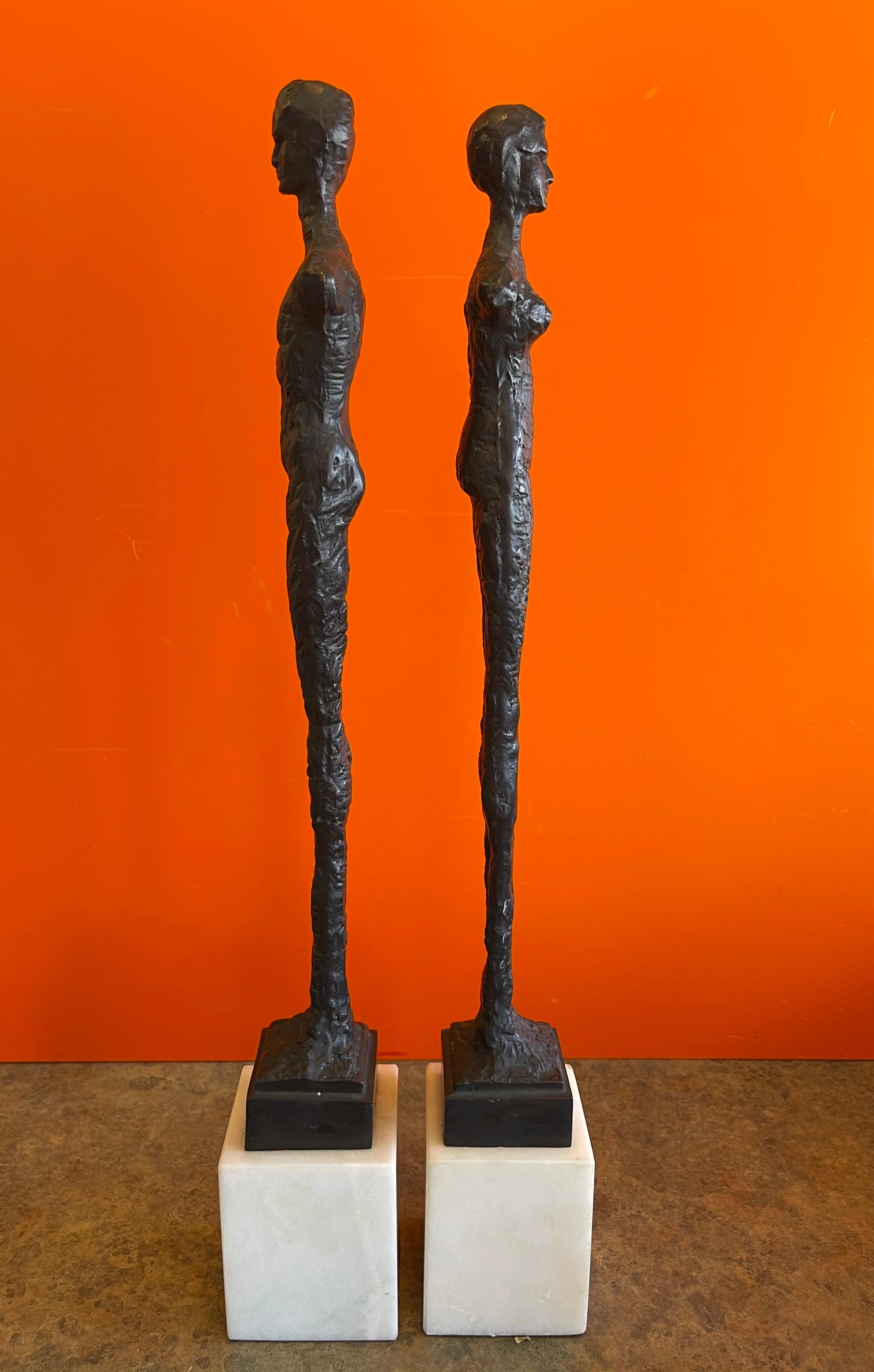 Cast Pair of Figurative Bronze Man & Woman Sculptures in the Style of Giacometti