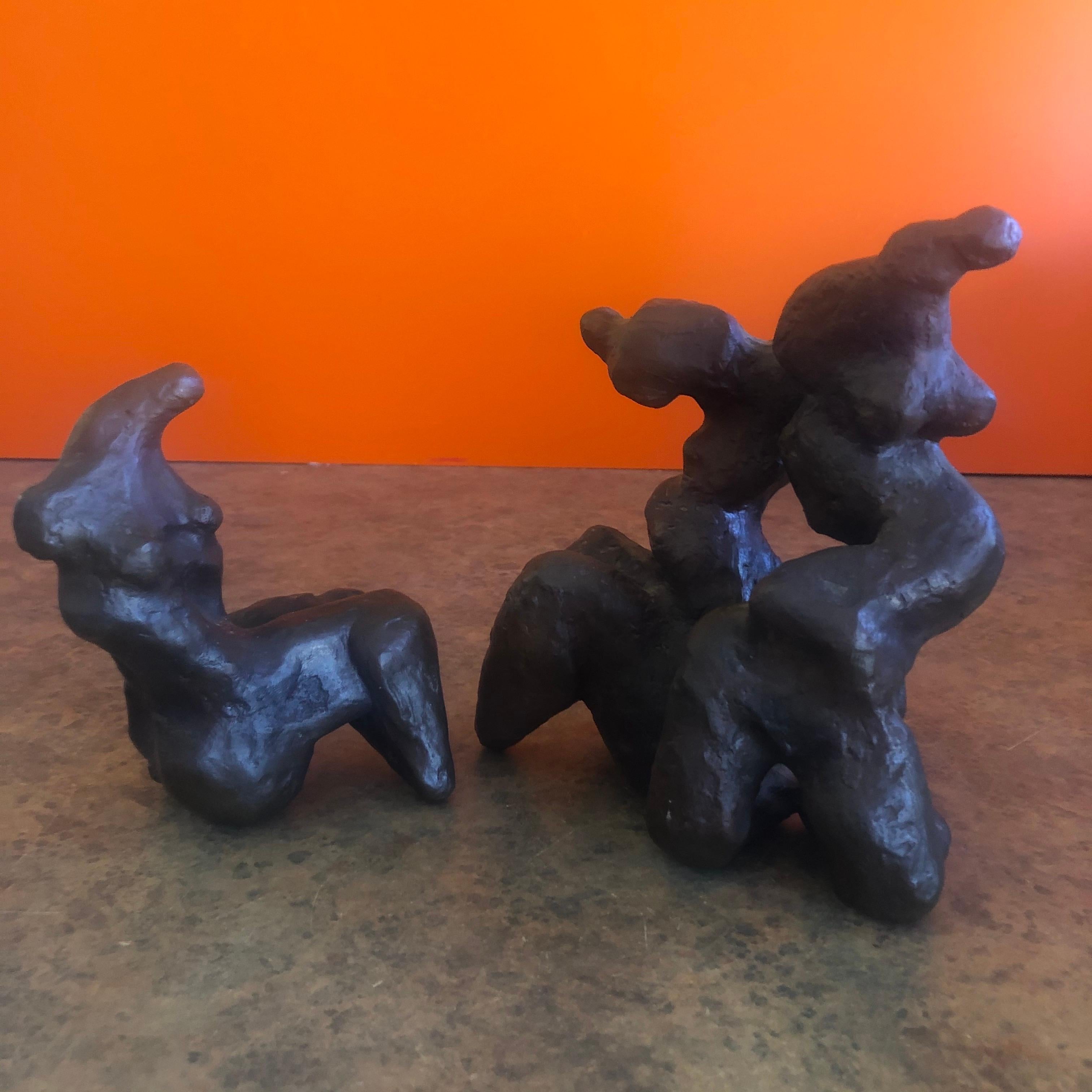 Pair of figurative female bronze sculptures by listed Chicago sculptor Robert Winslow, circa 1970s. The small piece measures 3.75