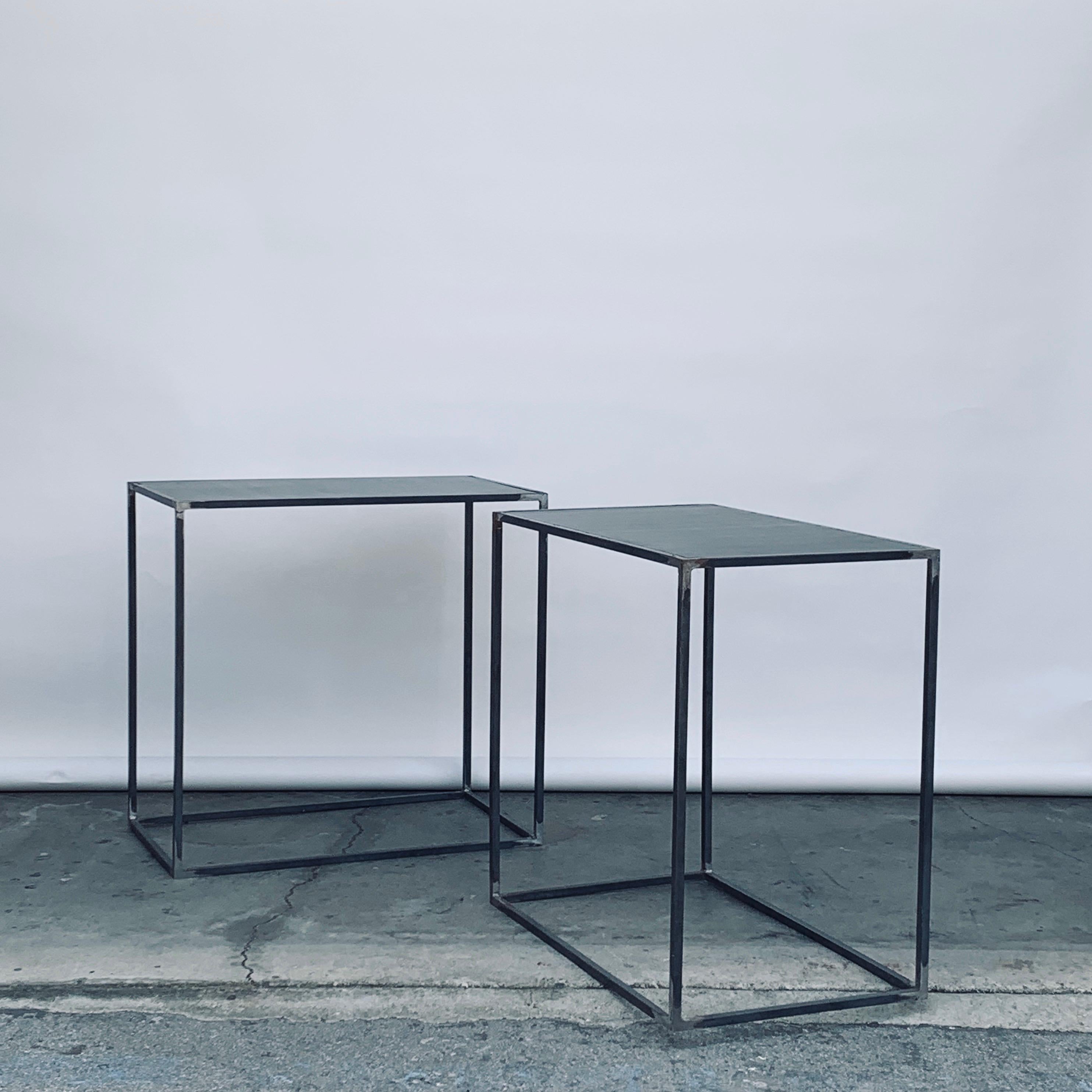 Pair of tall 'Filiforme' patinated steel plate side or occasional tables by Design Frères.

Also great as display pedestals.