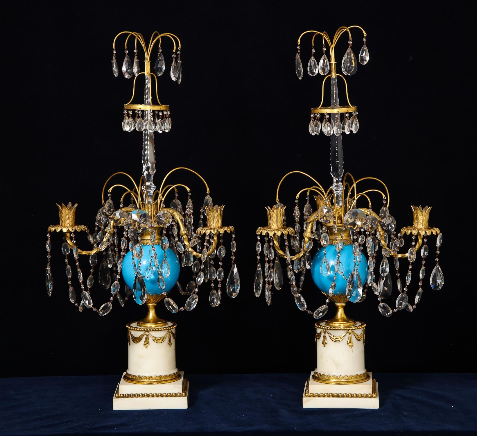 A pair of exquisite and highly important large antique Russian neoclassical gilt bronze, blue opaline glass, cut crystal and white marble candelabras of superb quality embellished with blue opaline glass, cut crystal chains, crystal prisms on gilt
