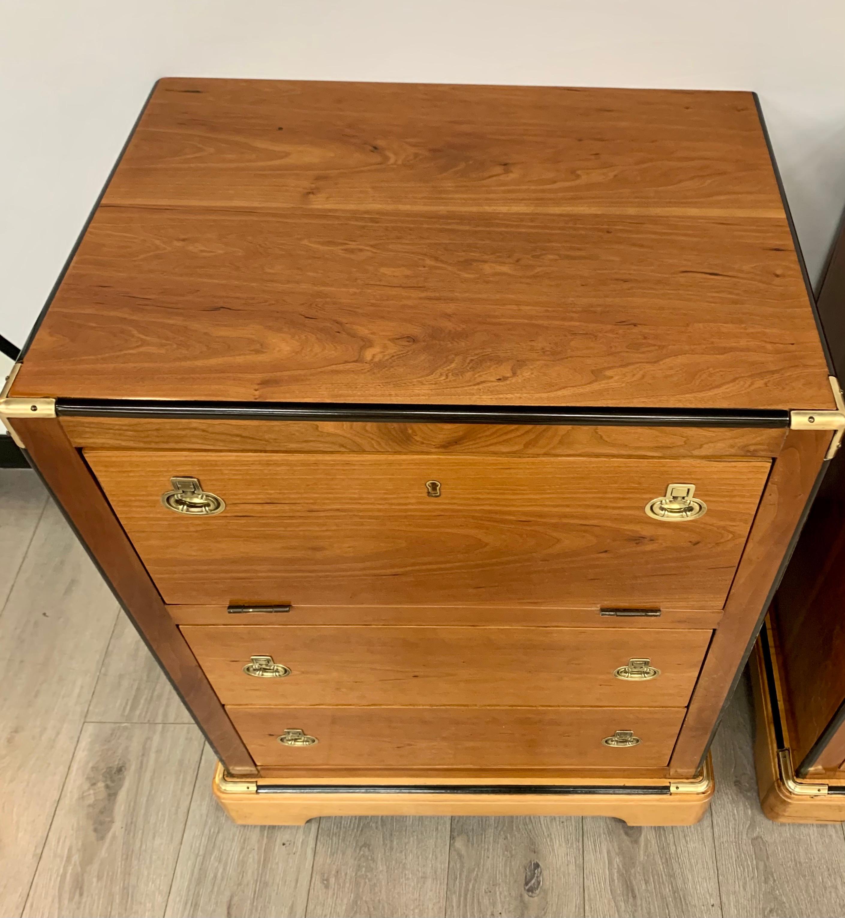 Rare and ultra coveted Biedermeier Campaign style pair of chests which features drop down drawer.
They have great scale and better lines and stand 29.5