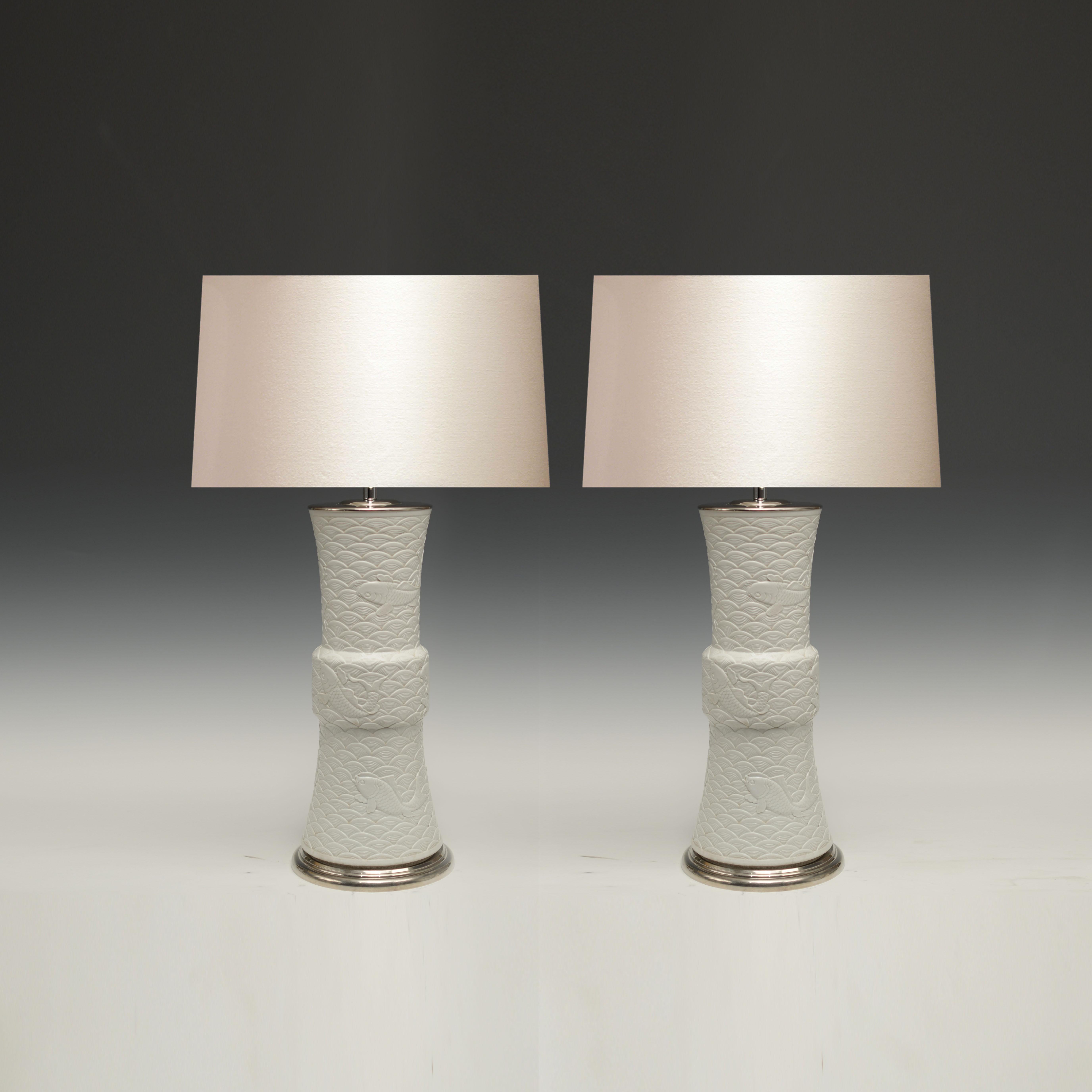 Pair of fine carved porcelain lamps with fishers swim in stylish waves decorations.
To the top of the porcelain 19