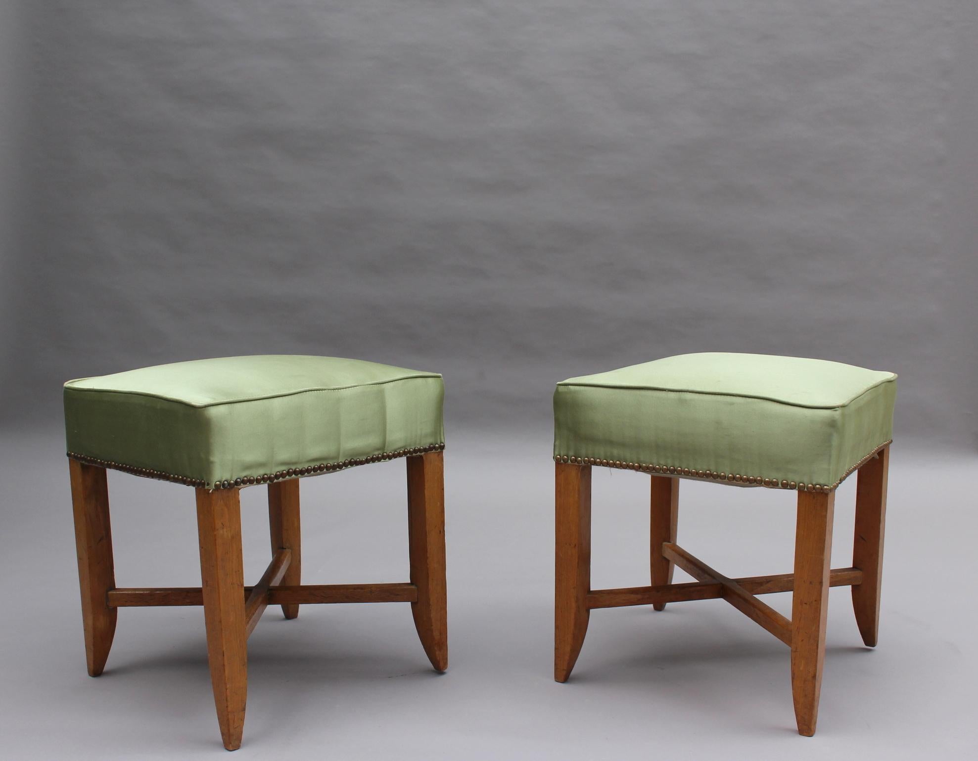 A pair of fine French Art Deco 4-legged beech stools.