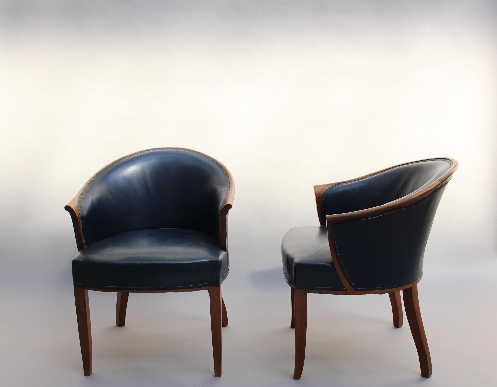 A pair of fine French Art Deco upholstered walnut visitor / lounge armchairs by Leleu.
