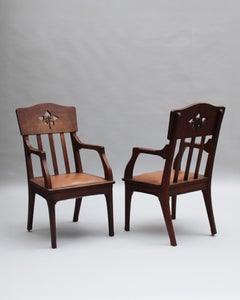 Paire de fauteuils en chêne massif Art Nouveau par Leon Jallot