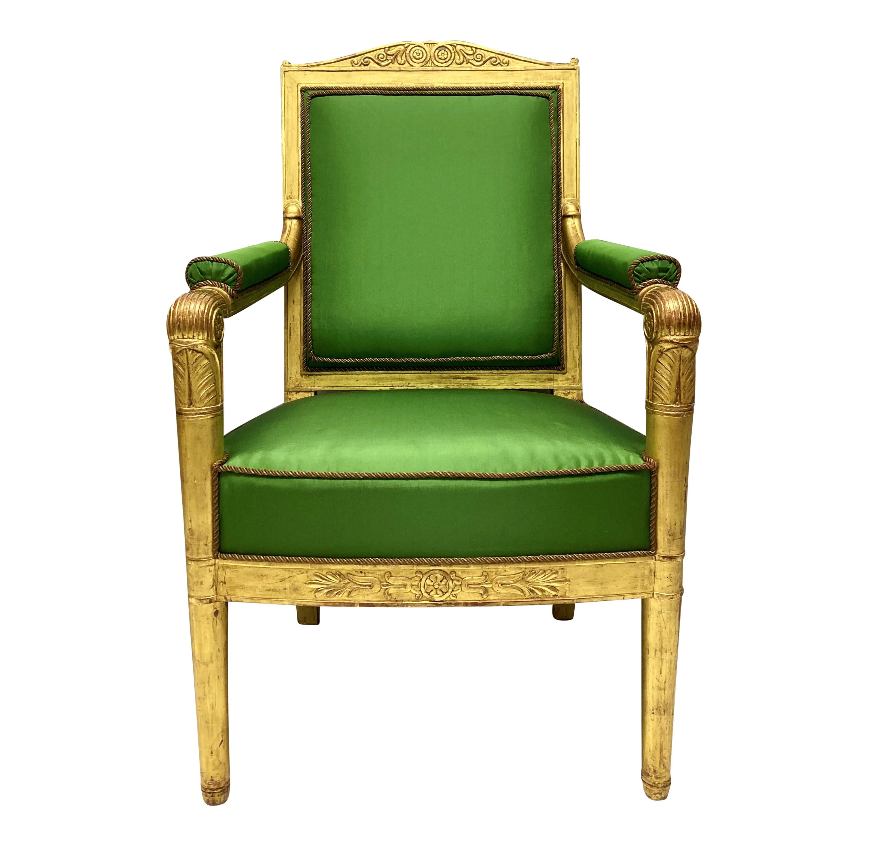 A fine pair of French Empire style armchairs, carved and water gilded with burnishing. Upholstered in apple green silk with rope piping and horsehair.

These chairs and the matching en-suite canape (sold separately) came from a Parisien apartment.
