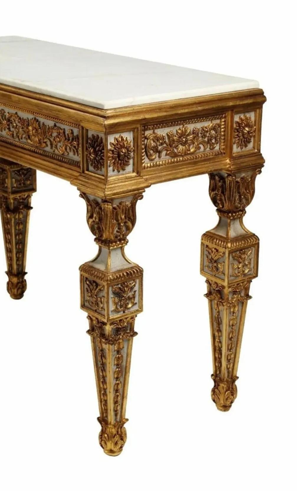 A magnificent pair of very fine quality Italian polychrome and parcel gilt marble top console tables. 

Most impressive large scale, the contemporary antique reproduction exceptionally executed in opulent 18th century Neo-classical taste, profuse