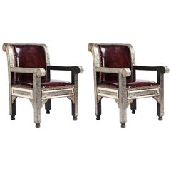 Paire de fauteuils bergères en cuir raffiné de style Hollywood Regency