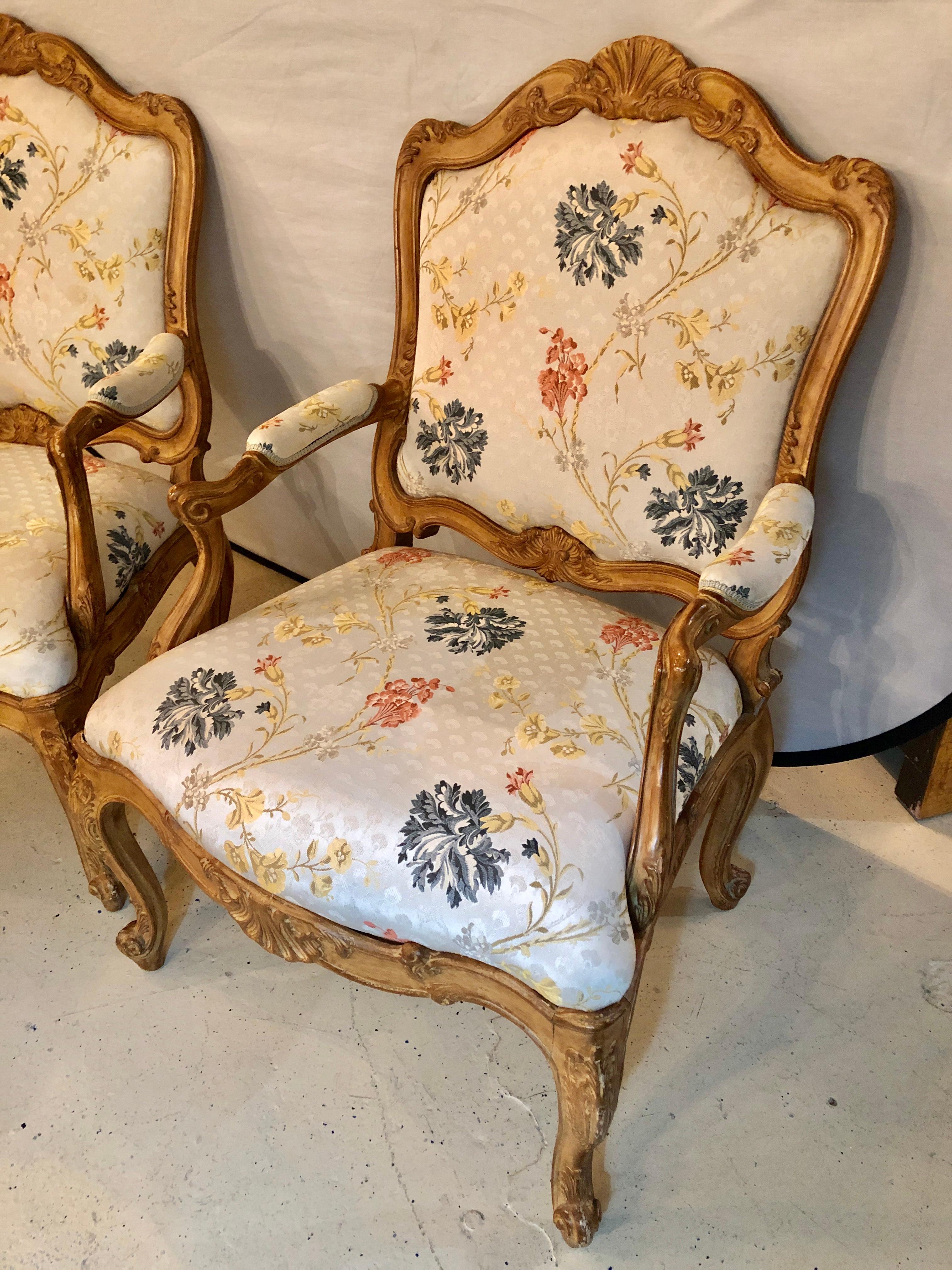 Pair of fine Louis XV style armchairs in fine upholstery custom frames. These wonderfully shell motif carved and finely recovered armchairs are simply stunning and are certain to add style and glamour to any room in the home or office.