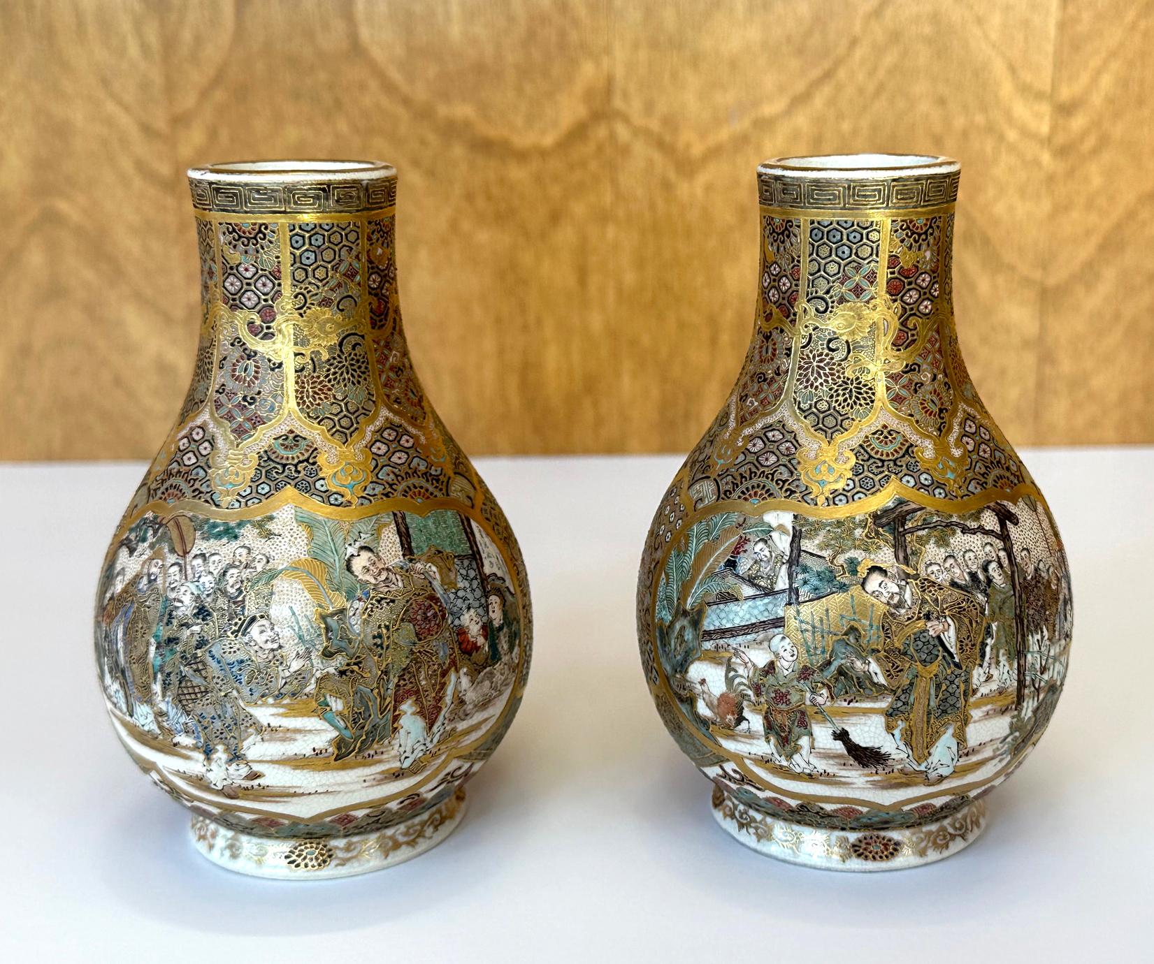 A pair of small ceramic vases with superb surface decorations made by Japanese studio Seikozan circa 1890-1910s (late Meiji Period). One of the many artist studios that specialized in satsuma ware, Seikozan was perhaps a handful exceptional