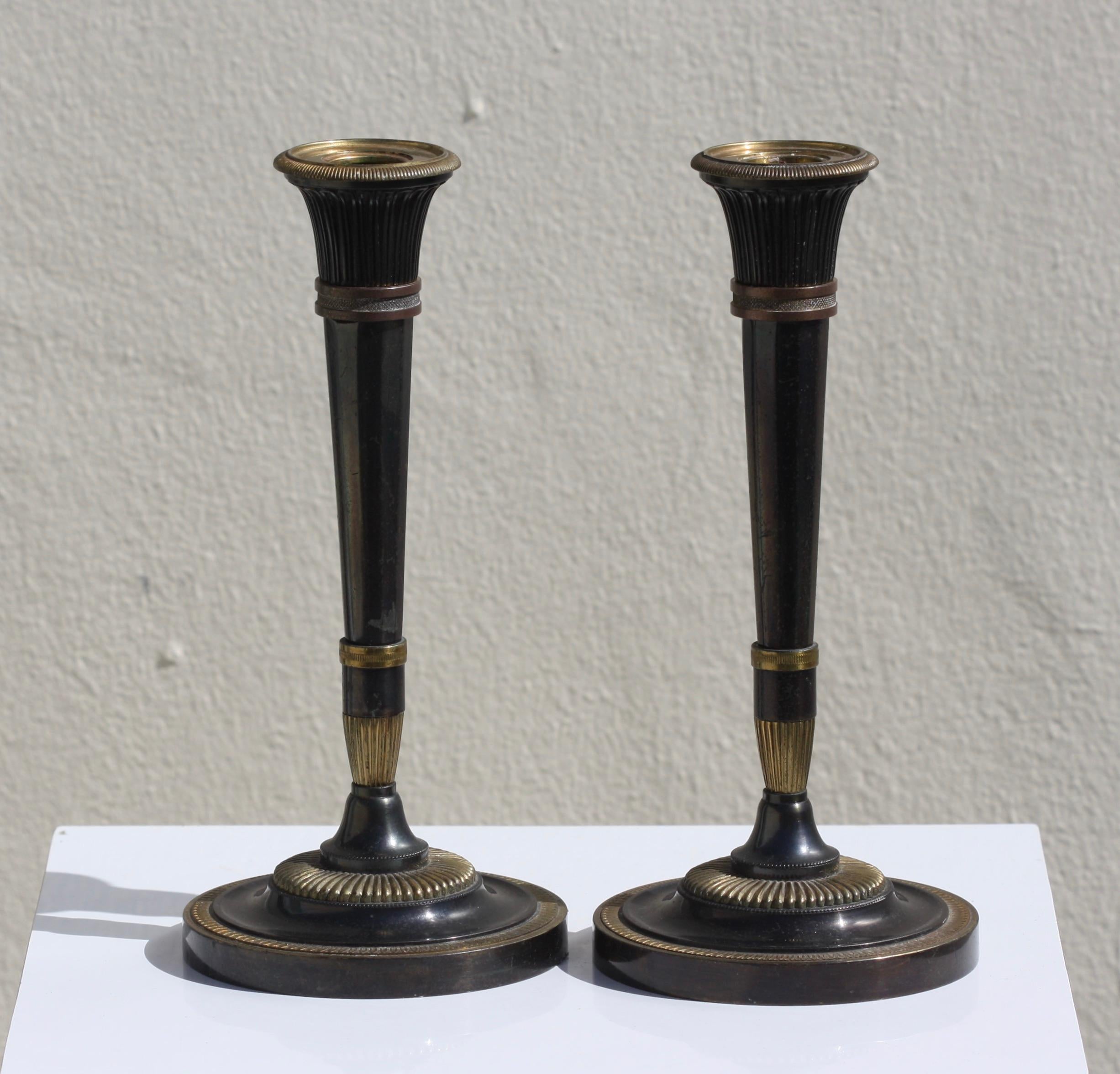 Pair of Fine Neoclassical Parcel Gilt Polished Steel Candlesticks For Sale 1