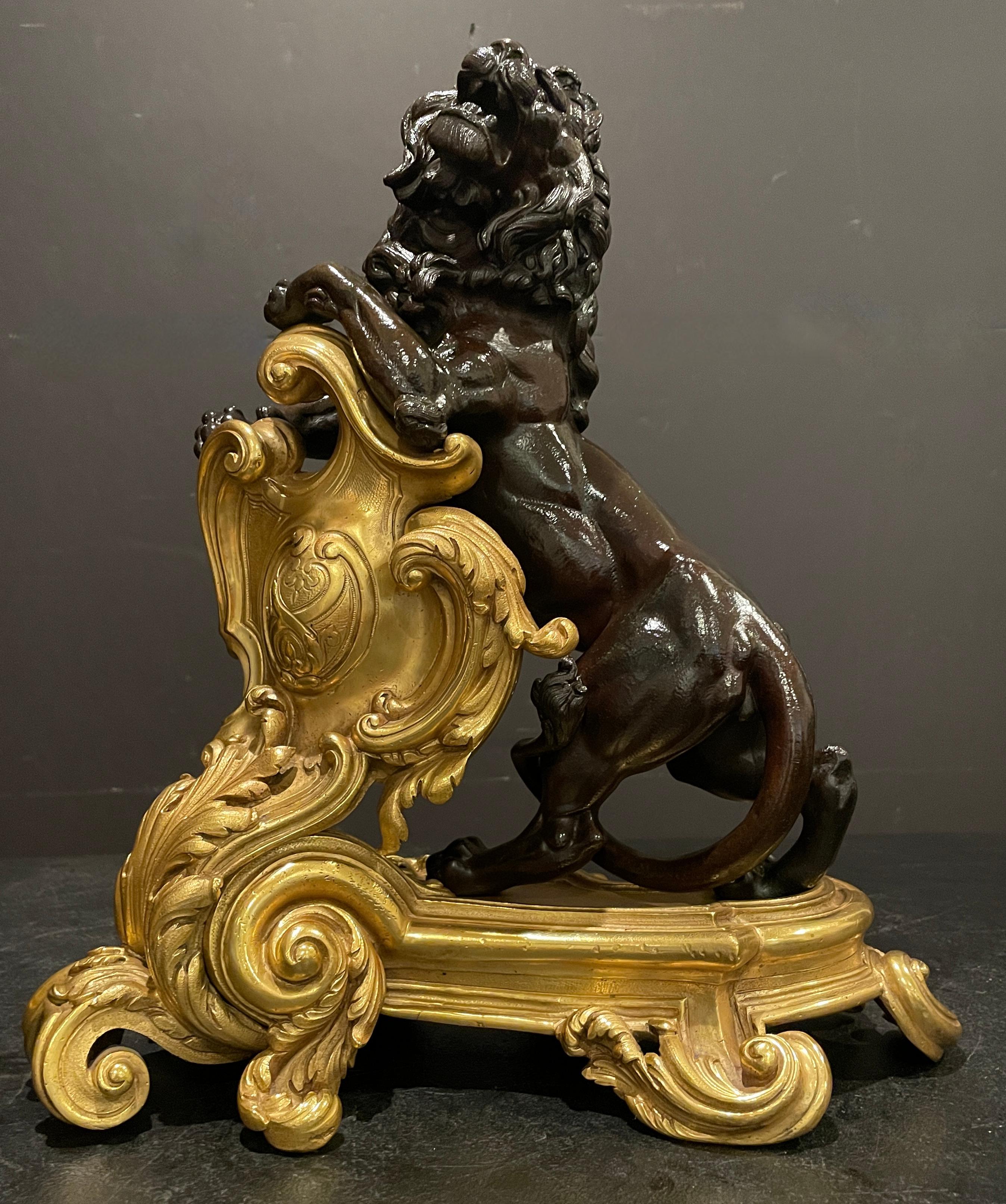 Rococo Fine Pair Of Figural Patinated and Gilt Lion Chenets For Sale