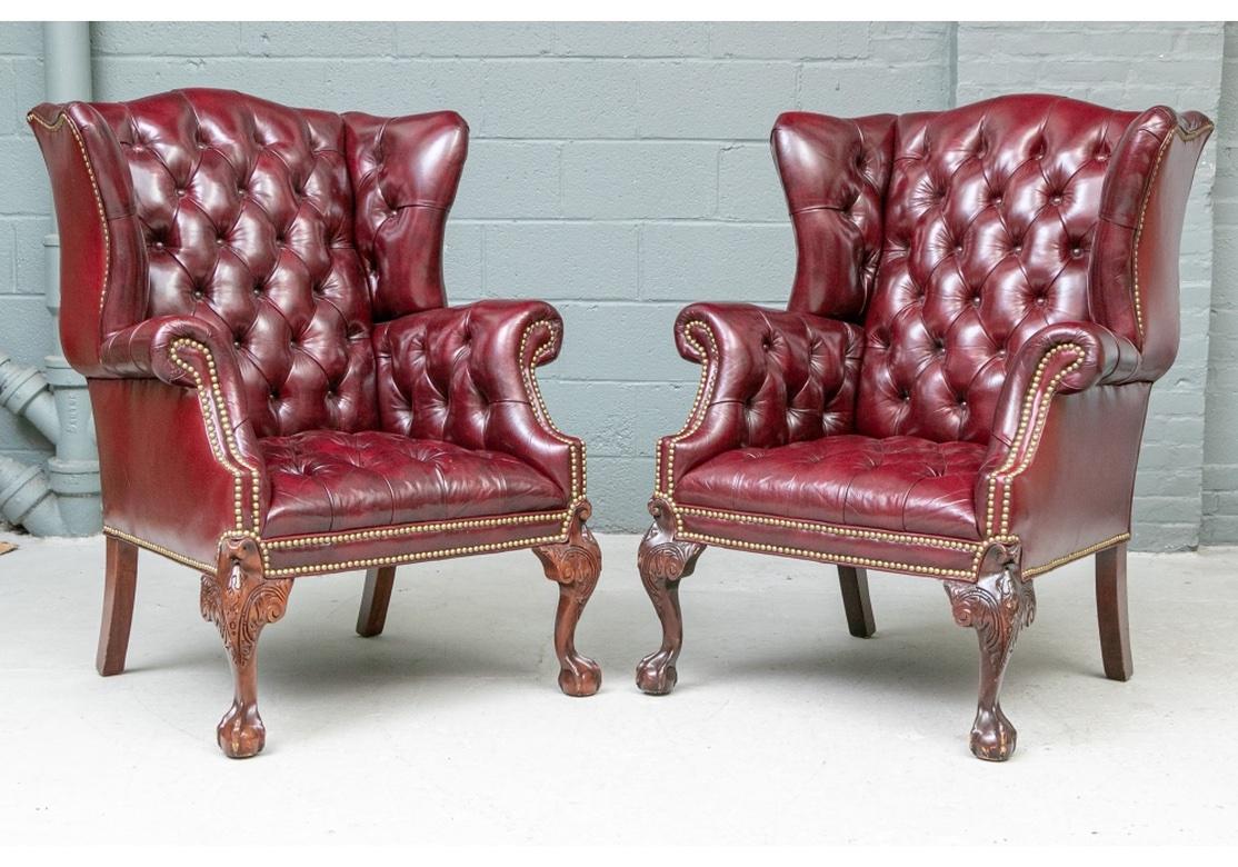 Carved Pair Of Fine Quality Glazed Oxblood Leather Wing Chairs