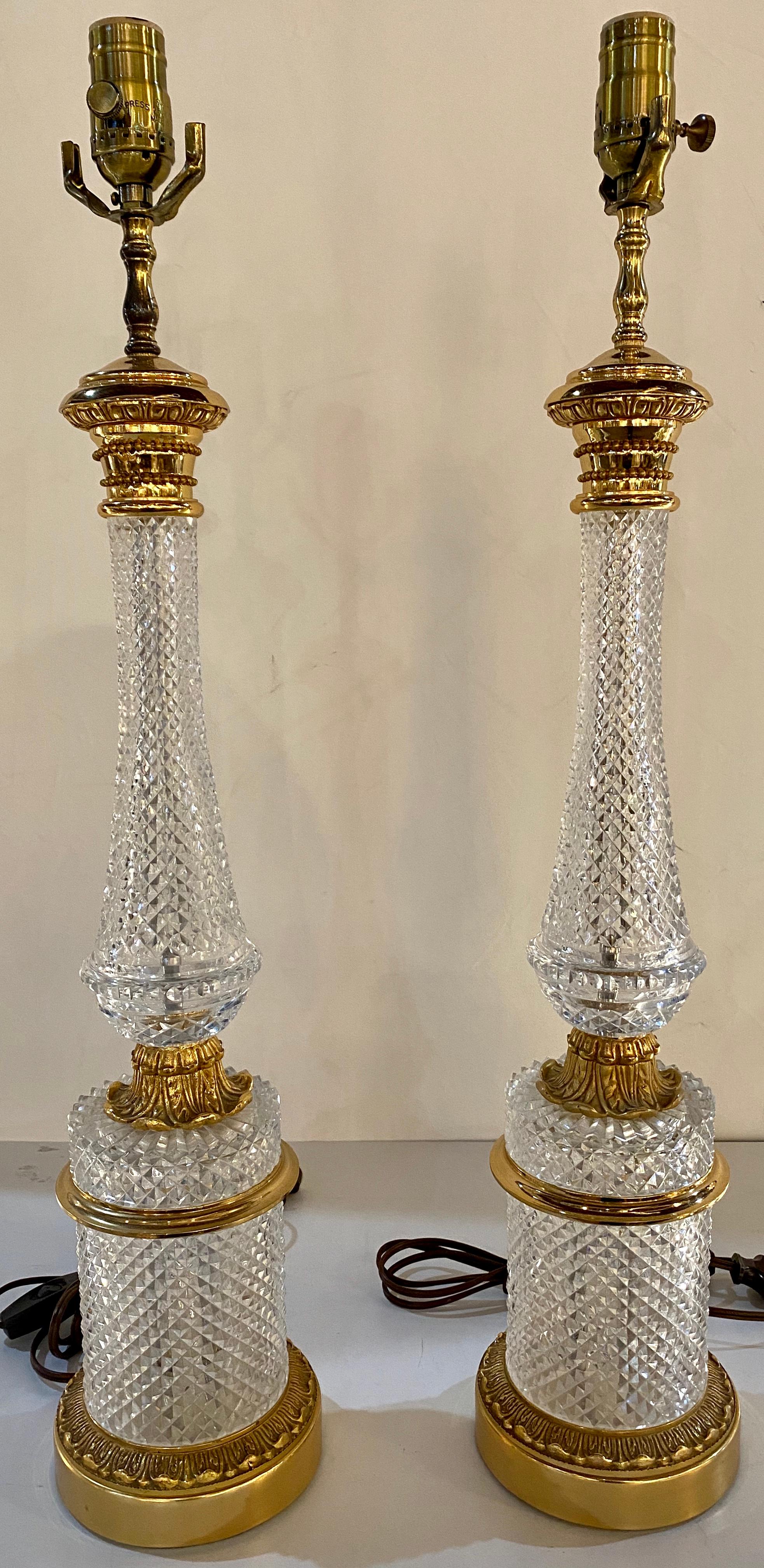 Pair of finely cut glass table lamps with bronze mounting Baccarat style. These column-form lamps do not have harps or shades.
SXA.