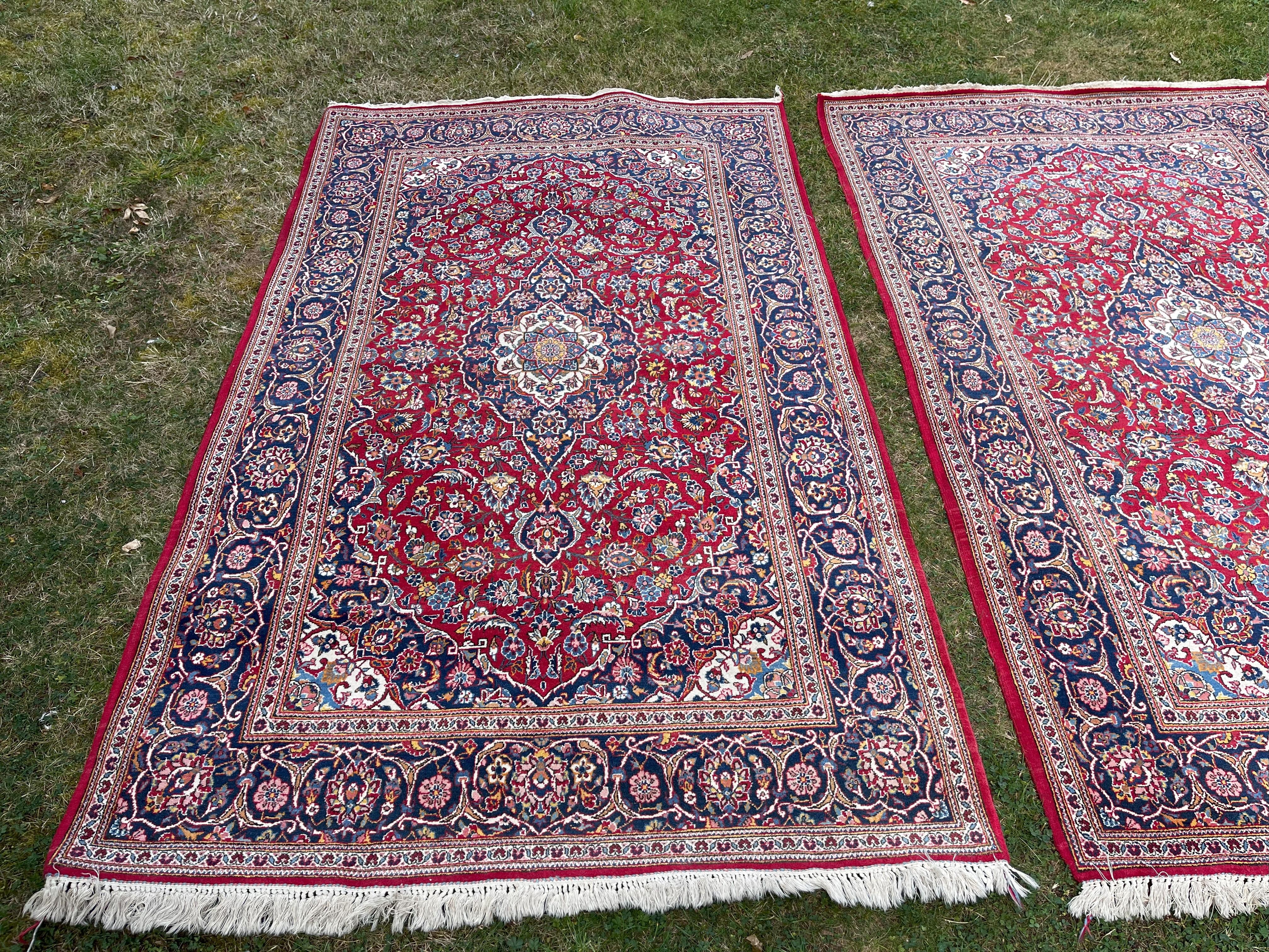 A matching pair of finely knotted wool Kashan rugs,  purchased by the original owner in Tehran, Iran circa 1963.  