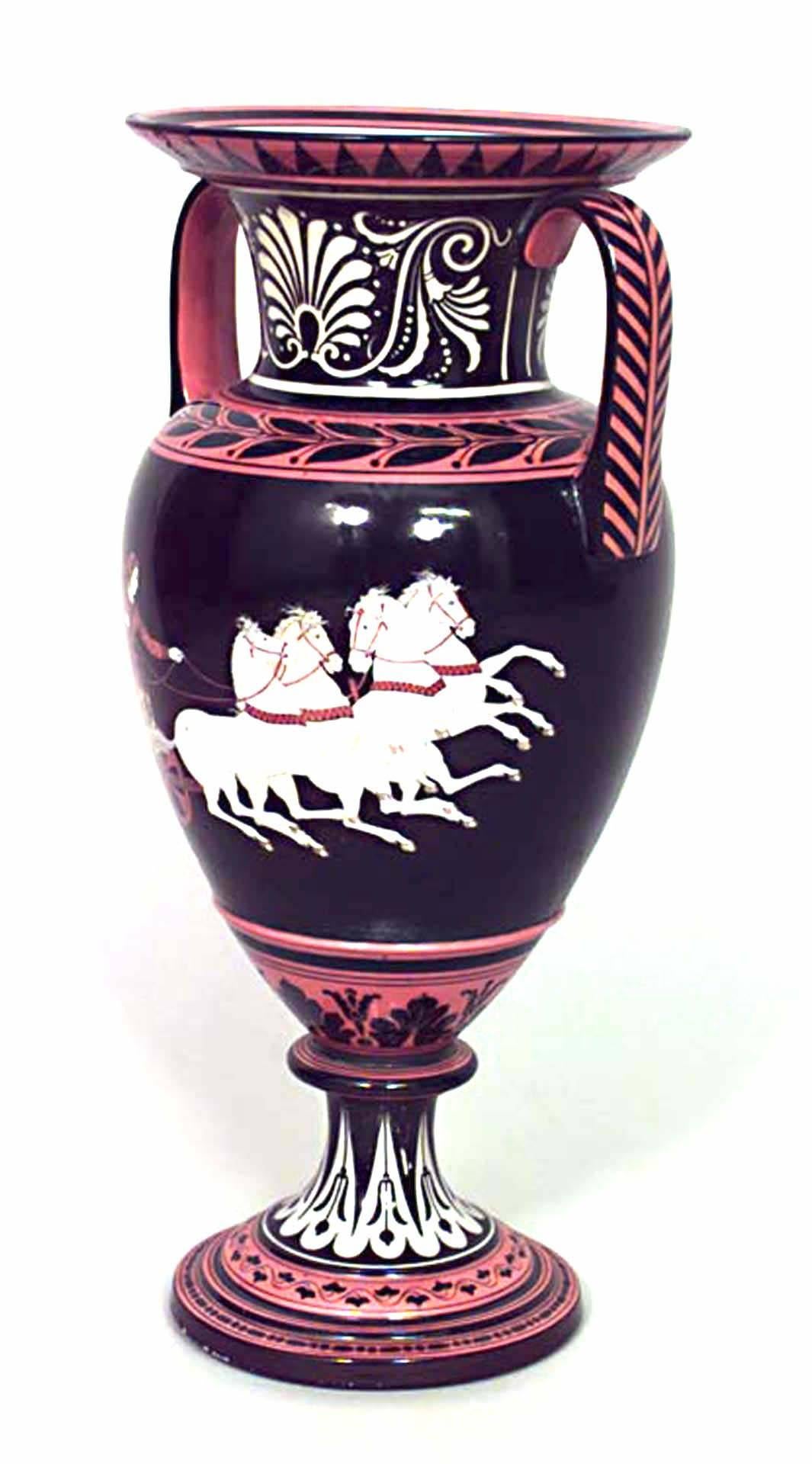 Pair of Grecian style (19th Cent) black and orange porcelain vases with handles and chariot scene. (PRICED AS Pair)

