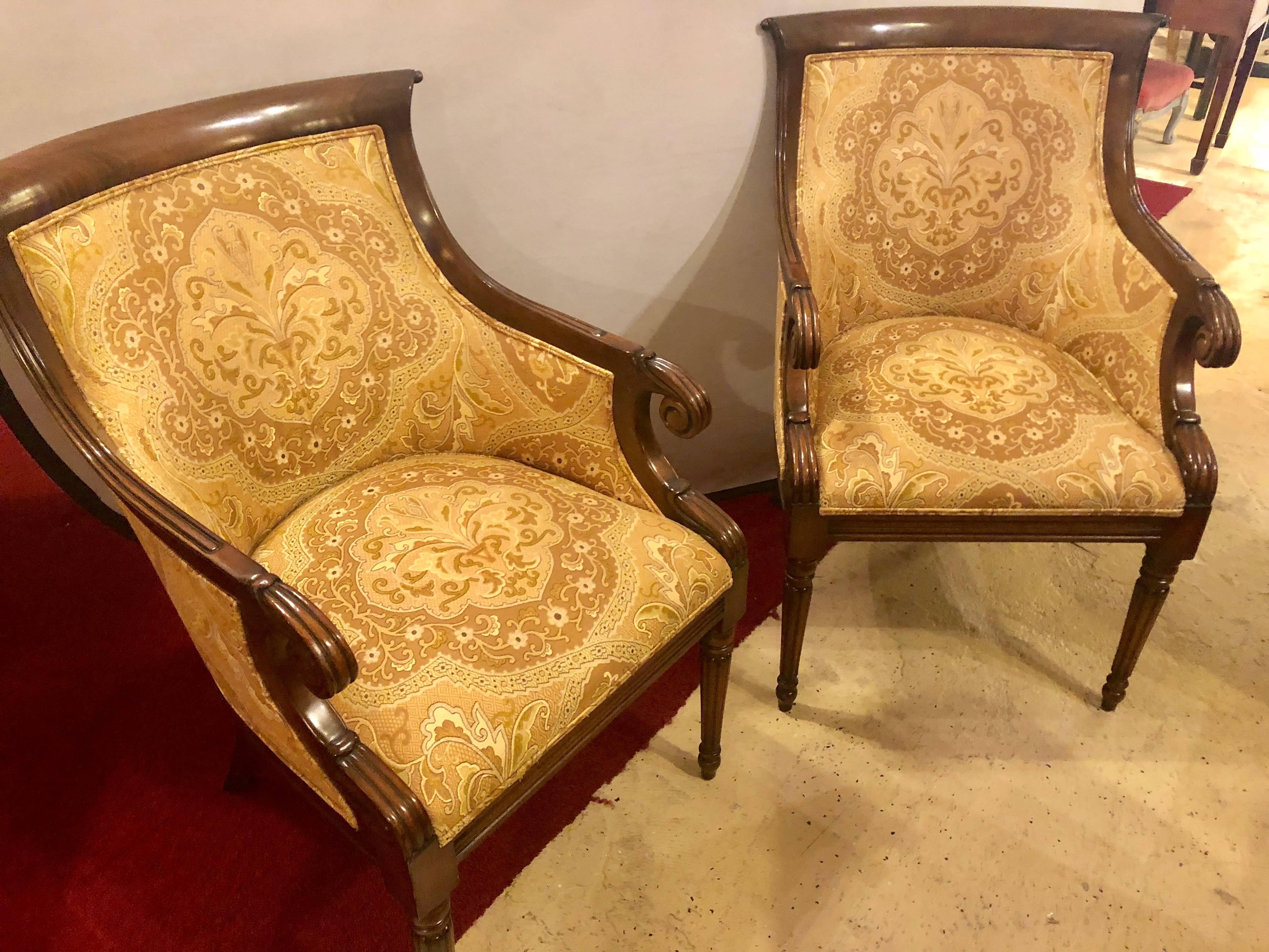 Pair of finely upholstered Smith and Watson office, bergere fireside armchairs. These custom quality Smith and Watson labelled chairs are wonderfully constructed and covered in a nice clean and desirable look. Having Louis XVI Style tapering legs to