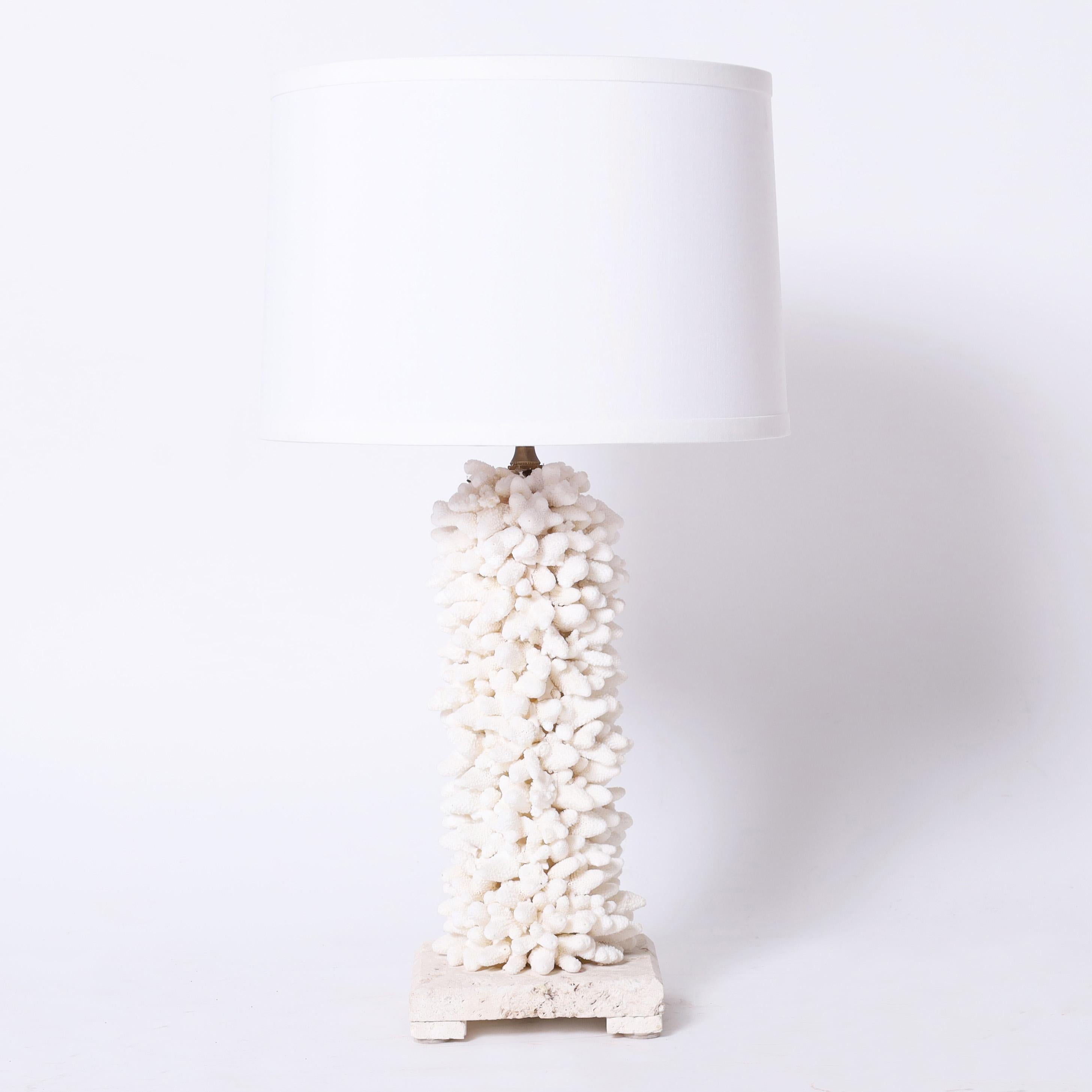 Standout pair of table lamps exclusively designed and handcrafted by F. S. Henemader Antiques in an ambitious composition using finger coral and presented on coquina bases.