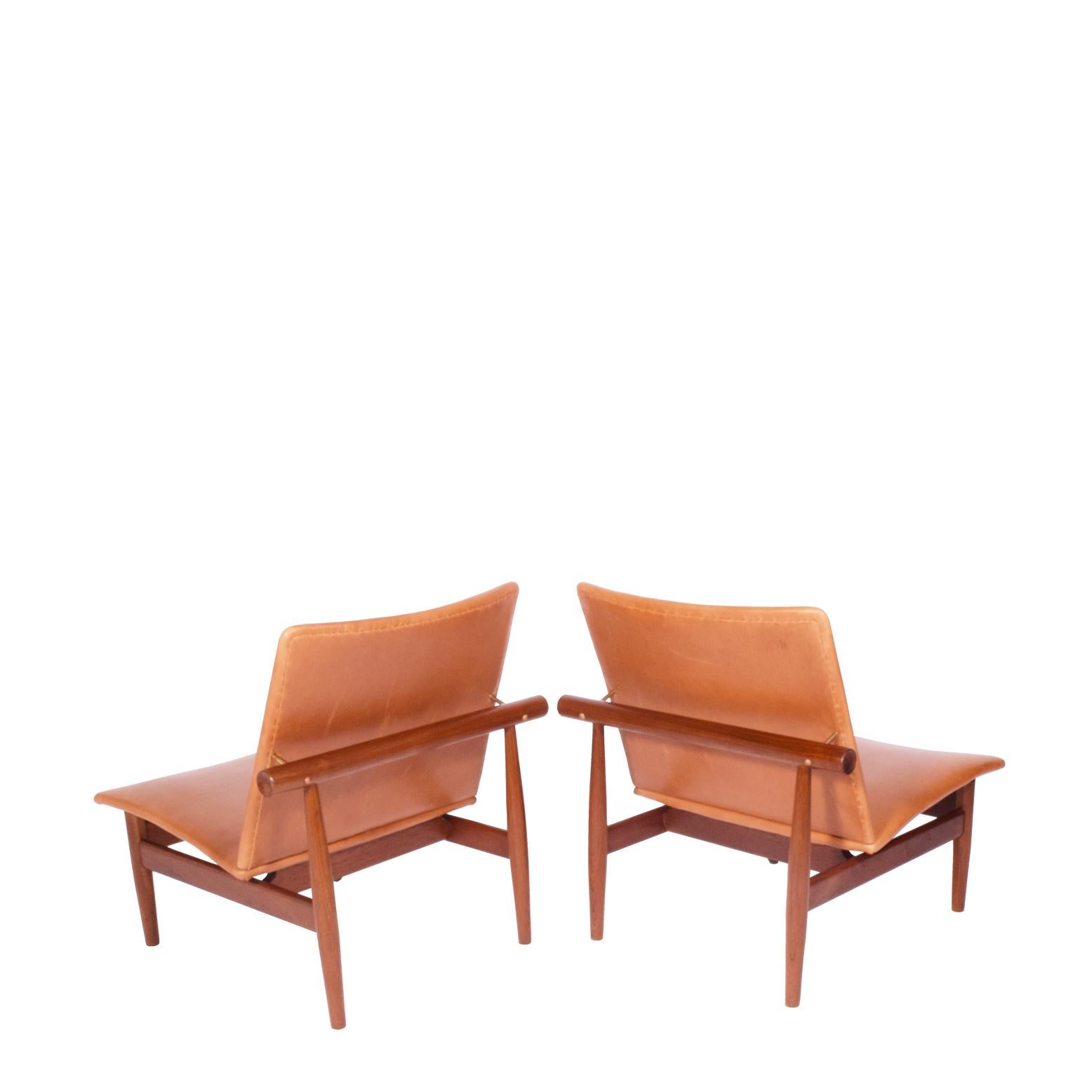 This solid teak model was designed by Finn Juhl for mass production but maintained his eye for beautiful proportions and warmth. Also made were two-seat and three seater sofas with labels. The chair was upholstered approximately 10 years ago.