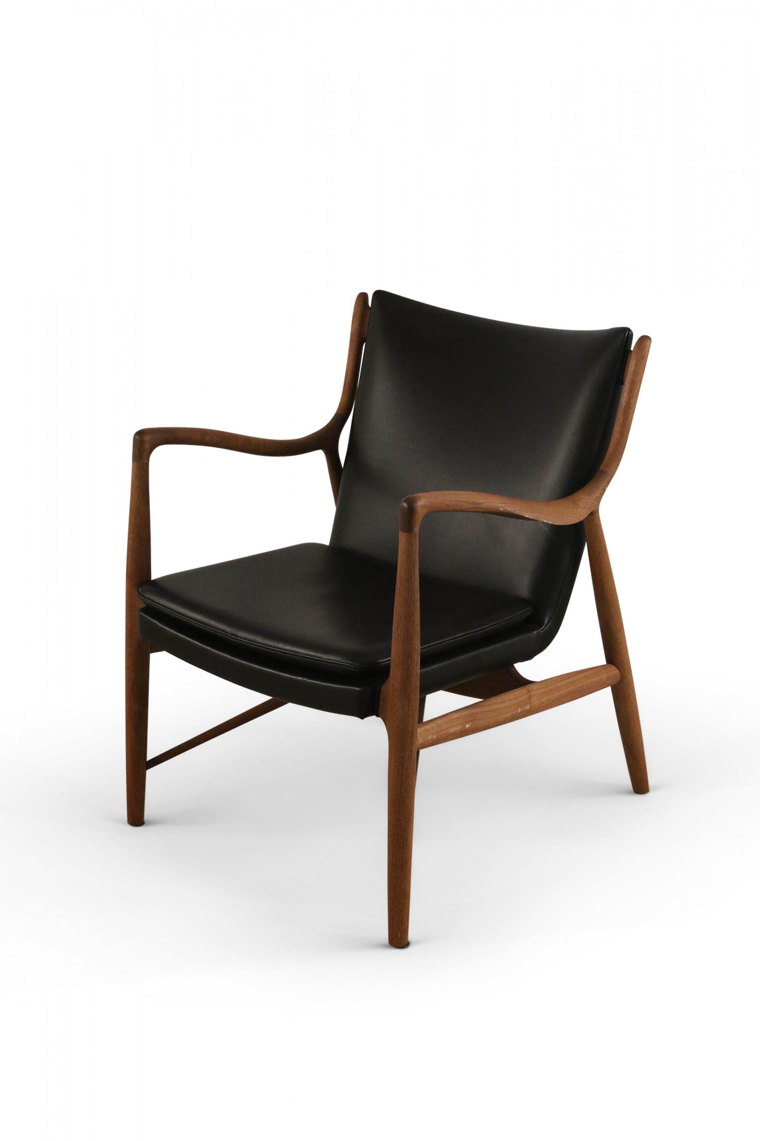 Pair of mid-century Danish armchairs with teak wood frames and black leather seats (FINN JUHL-model 45) (PRICED AS PAIR).
 