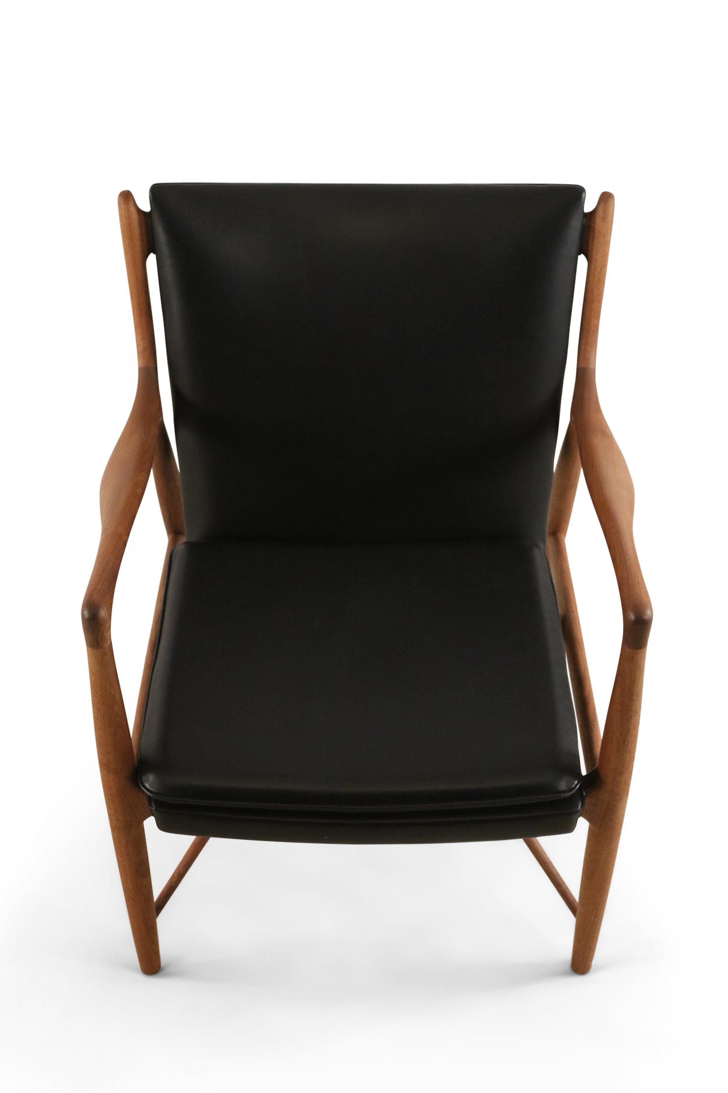 Pair of Finn Juhl Mid-Century Danish Teak and Black Leather 45 Armchairs In Good Condition In New York, NY