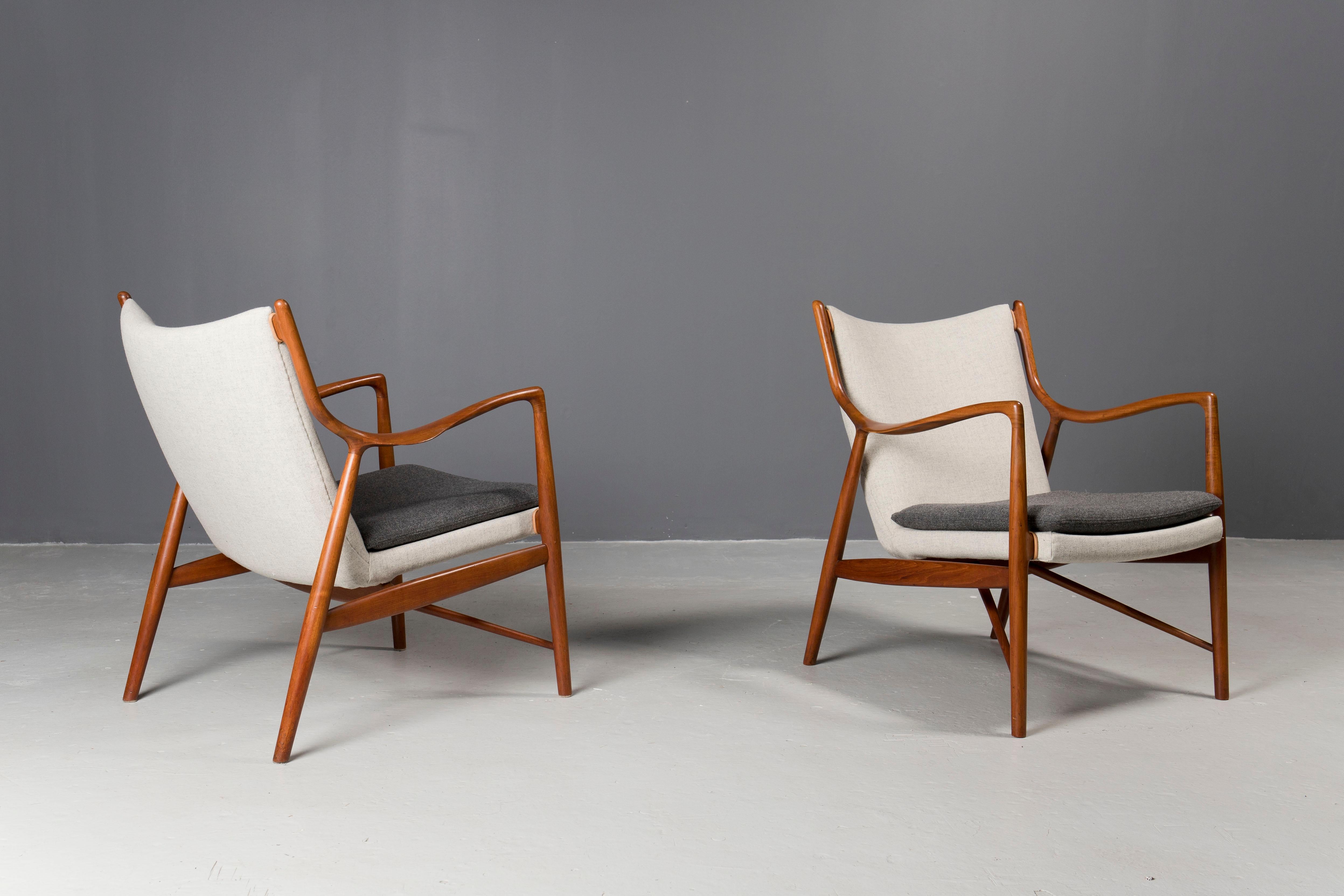 One of most iconic designs by Danish architect Finn Juhl,  this pair of 45 chairs was executed by his cabinetmaker Niels Vodder in the early 1950s.
Sculptural teak frames have been professionally refinished and upholstery is newly upgraded in danish