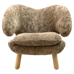 Pair Of Finn Juhl Pelican Chair in Sahara Sheepskin