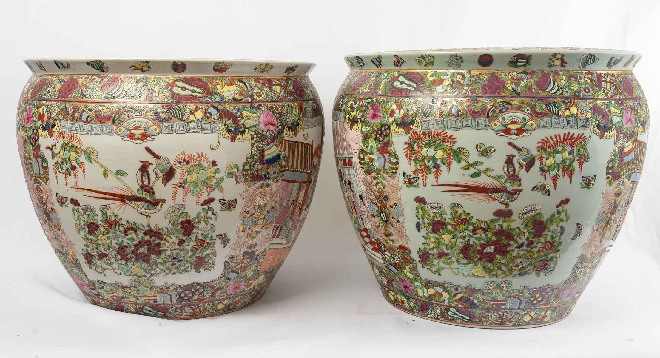 Magnificent pair of Chinese porcelain fish tanks, with fine cloisonné enamel decorations of animated scenes of characters, flowers, birds, butterflies on a white background on the outside and decorated with five fish among aquatic plants on the