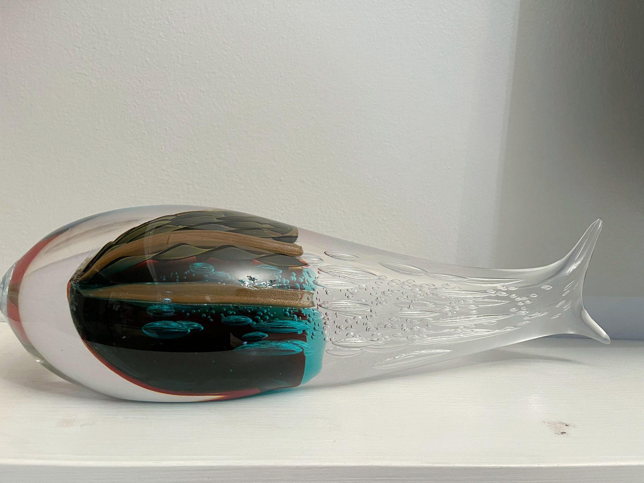 Pair of Italian abstract fish sculptures, hand blown and crafted in multiple colors of Murano glass by Sergio Constantini 
Signed “Constantini Murano” on the base / Made in Italy in the 1980’s 
Length 18 inches, width 5.5 inches, height 4.5 inches,