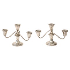Pareja de candelabros Fisher Silversmiths de plata de ley