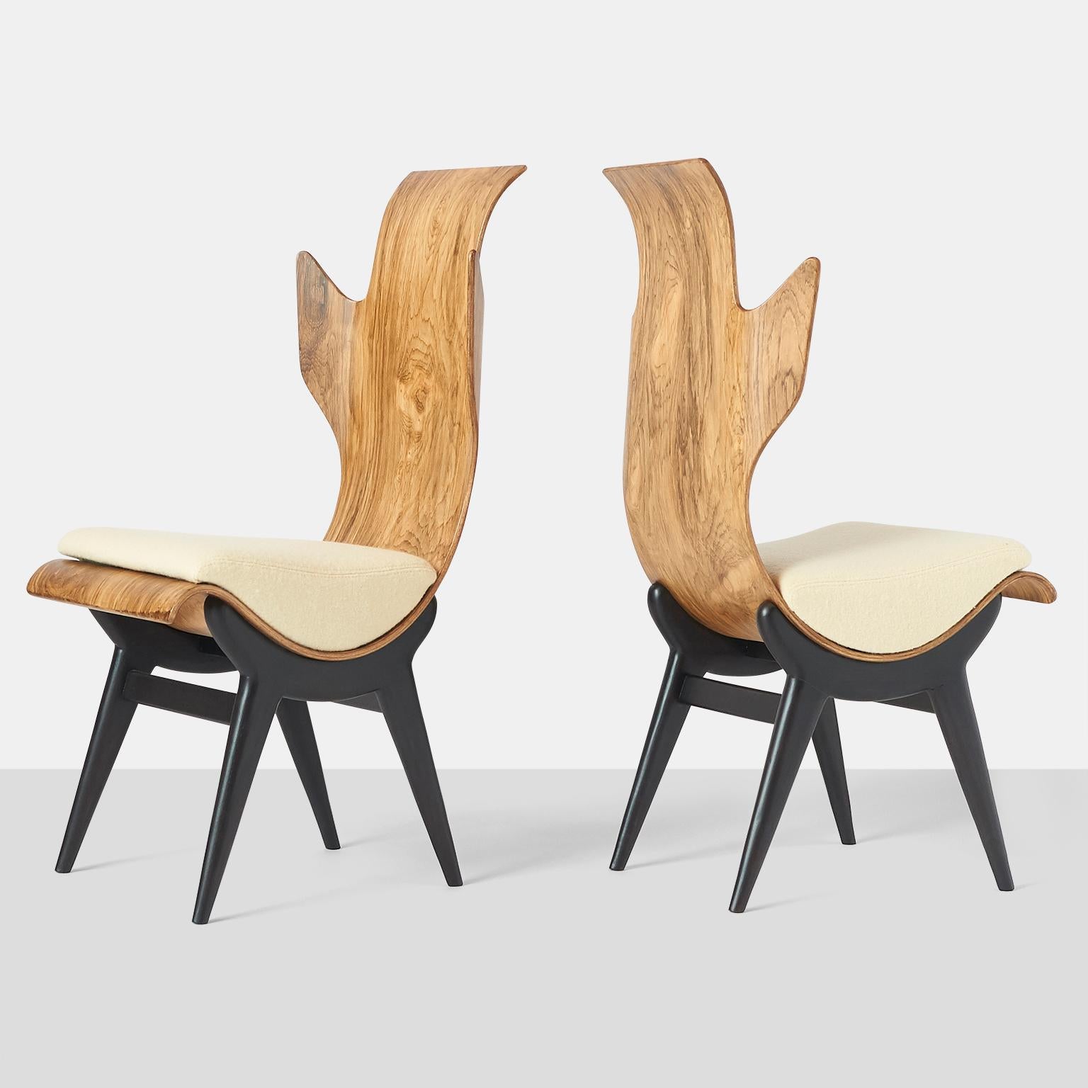 A pair of very rare and sculptural Pozzi & Verga model ‘2/R’ or 'Flame' chairs, designed by Dante LaTorre. The chairs are made of bent, laminated rosewood on an ebonized ash frame. They have fixed cushions with a ivory boiled wool upholstery. The