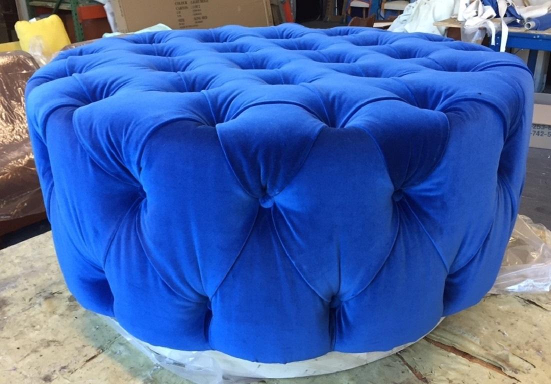 Pair of Flavor Custom originals modern blue tufted ottomans has a round wooden white platform base with blue velvet upholstery. Ottomans would look amazing in a walk-in-closet.
Ottomans are part of our Flavor Custom Design (FCD) furniture line.