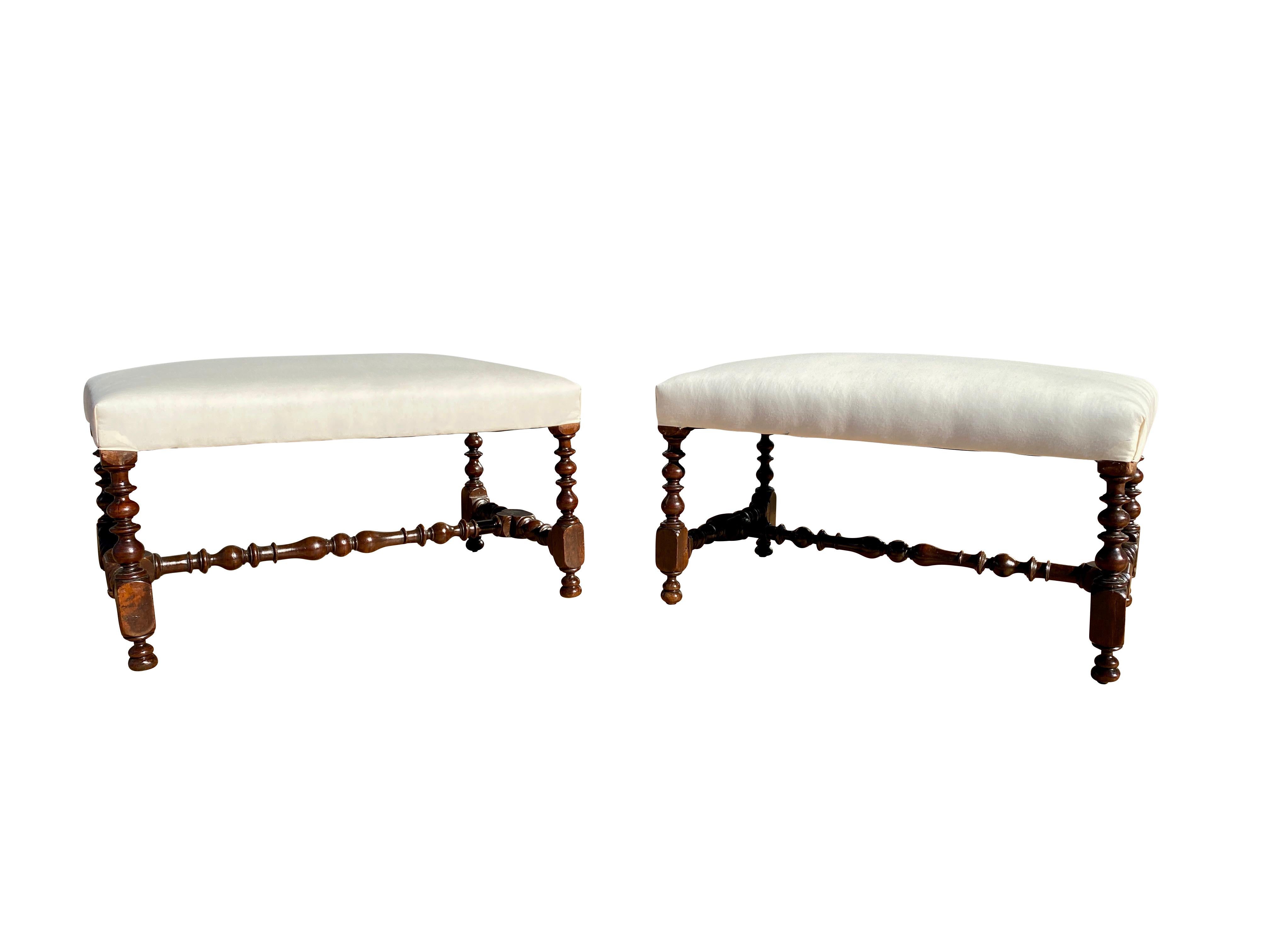 Each with rectangular newly upholstered muslin seats and raised on turned legs and stretchers.