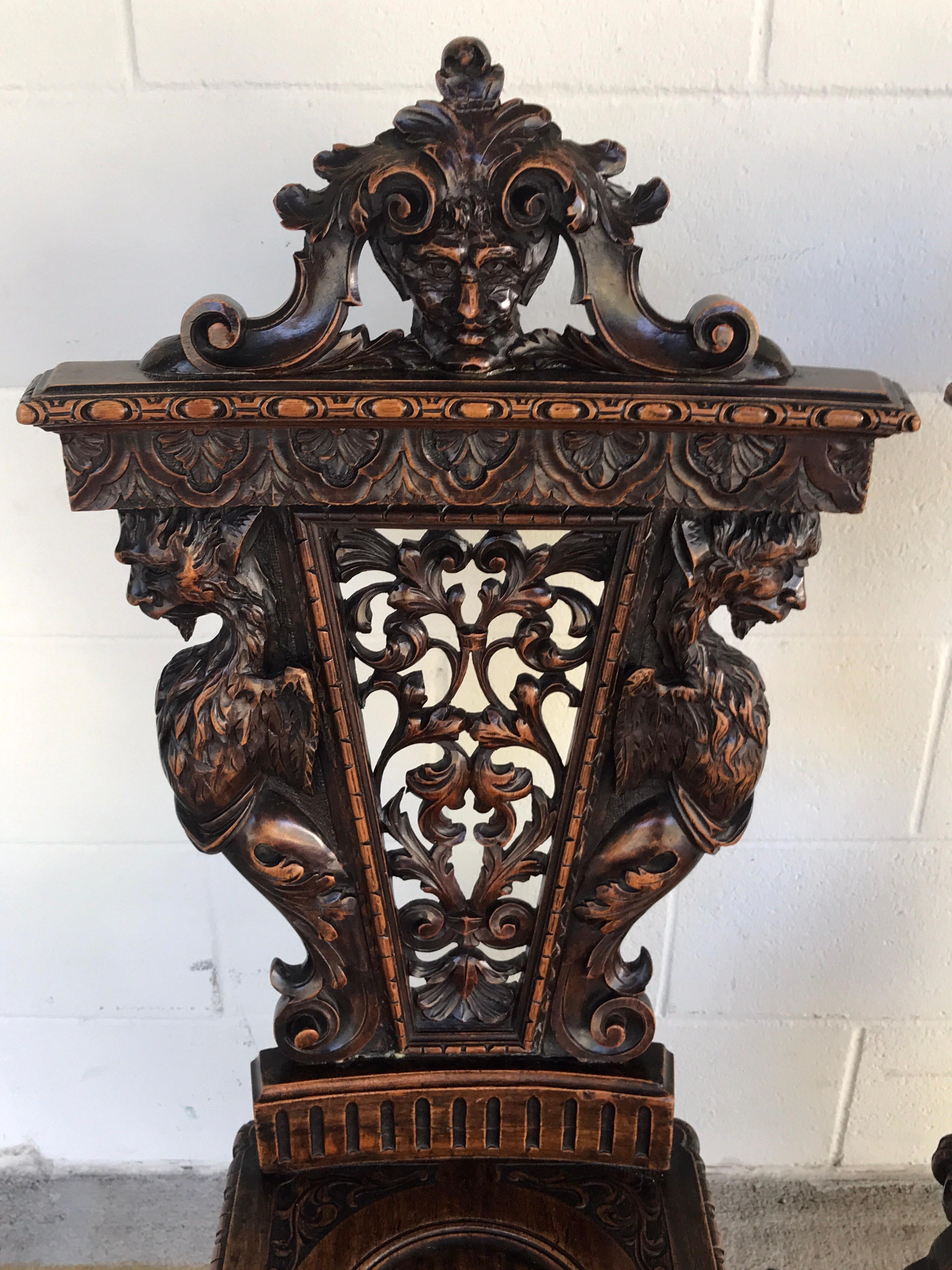 Renaissance Pair of Flemish Carved Walnut Fireside Chairs
