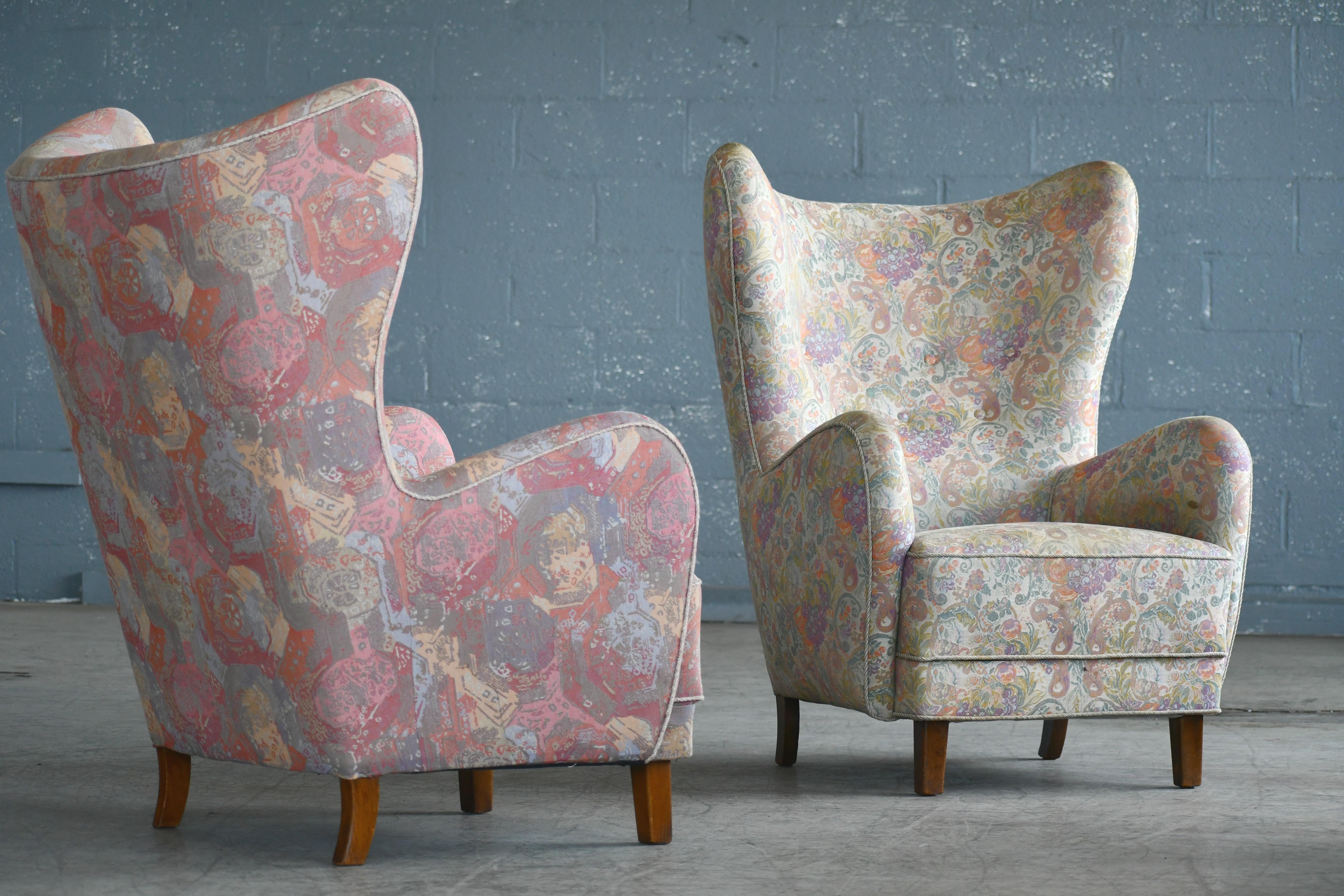 Beautiful Flemming Lassen attributed high back lounge chairs made, circa 1940. This iconic lounge chair is probably one of the most perfect high backs ever designed. Perfect statement piece with its ultra-elegant sensual shape yet very comfortable