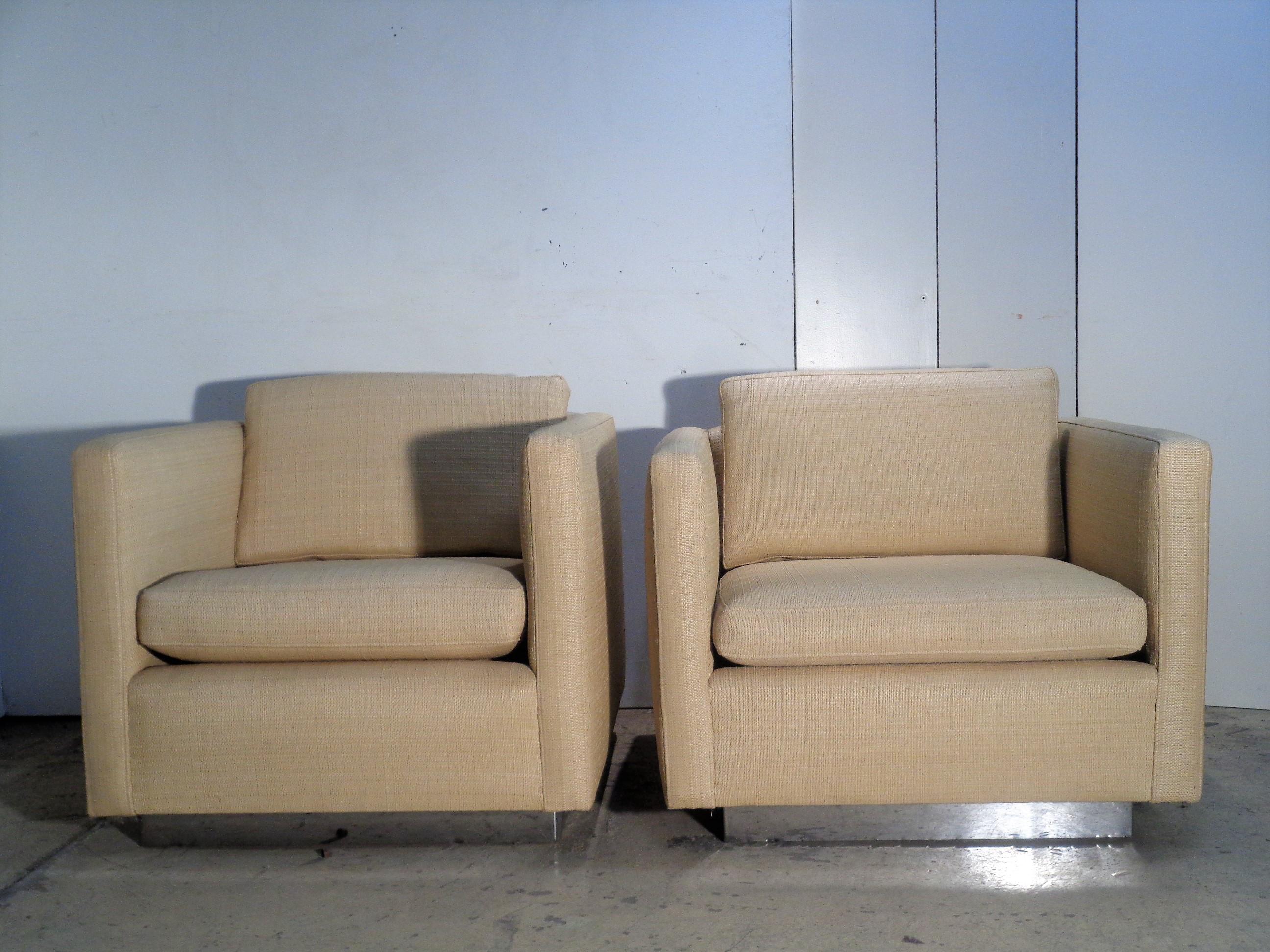 A great looking pair of Milo Baughman style floating cube lounge chairs with recessed chrome bases. Chairs were redone in a beautiful high quality custom grass cloth upholstery about fifteen years ago and have seen very little use since that time.